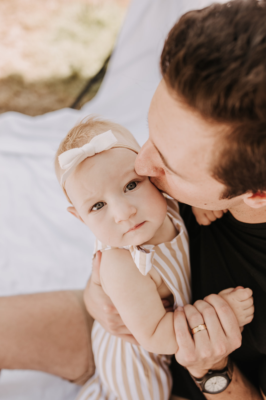 outdoor family photos San Diego family photographer candid family photos mom and dad and baby backyard mini session white backdrop photography