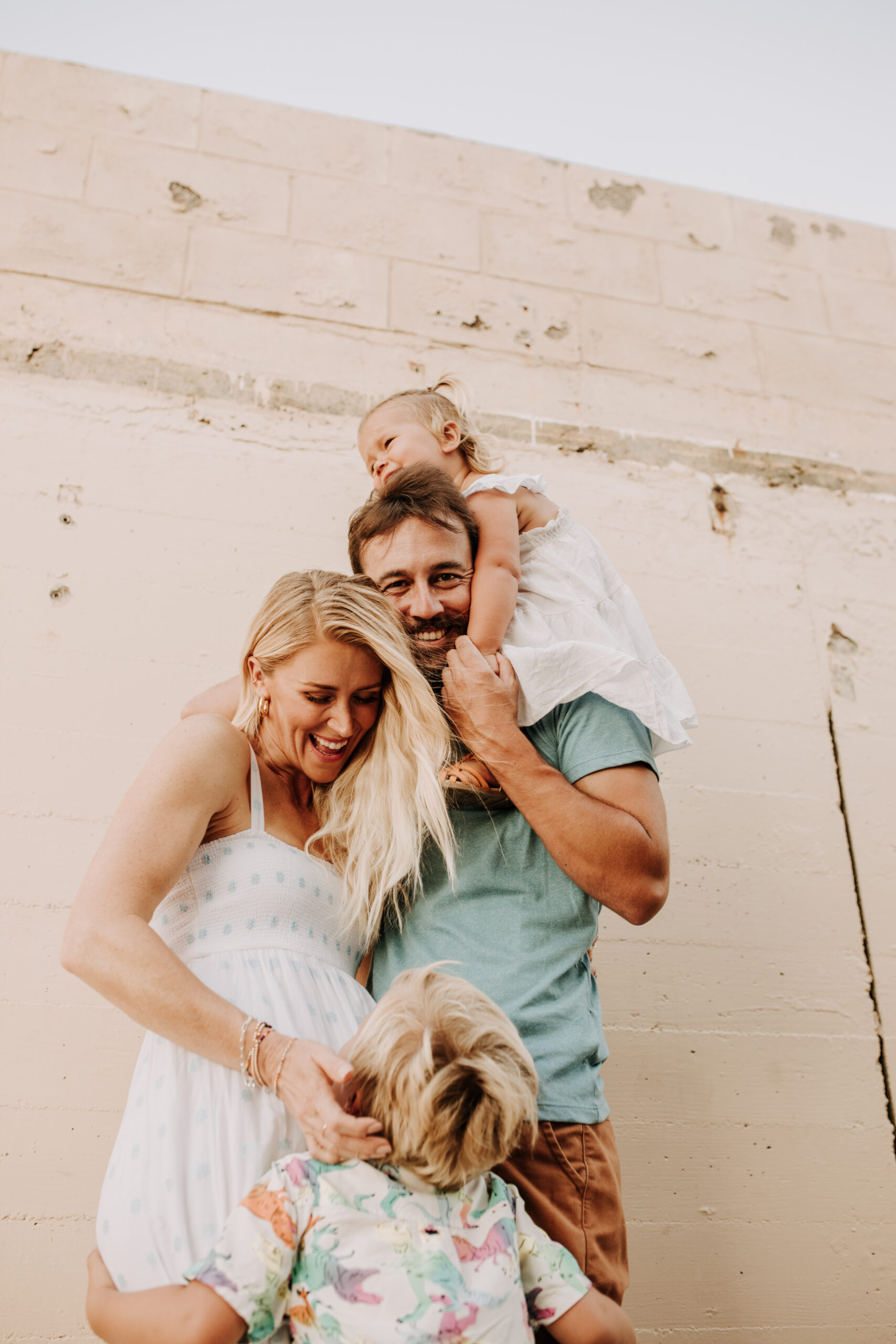 Family photos on the beach cool blue toned family photos San Diego photography family of four candid family moments family love beach family photos San Diego family photographer Sabrinalynnphoto