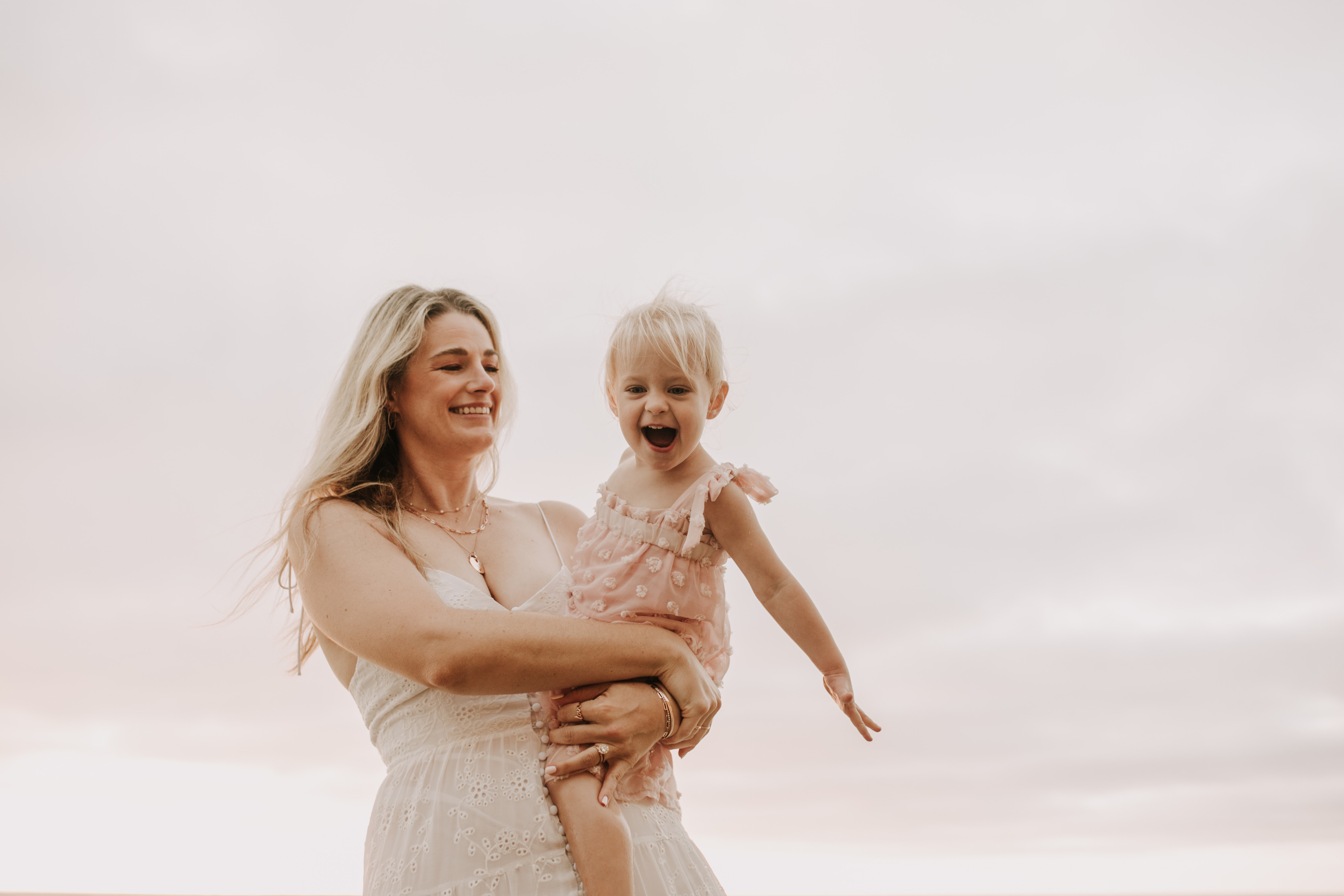 family photos on the beach sunset beach family dad mom baby water golden hour San Diego beach family photos San Diego family photographer