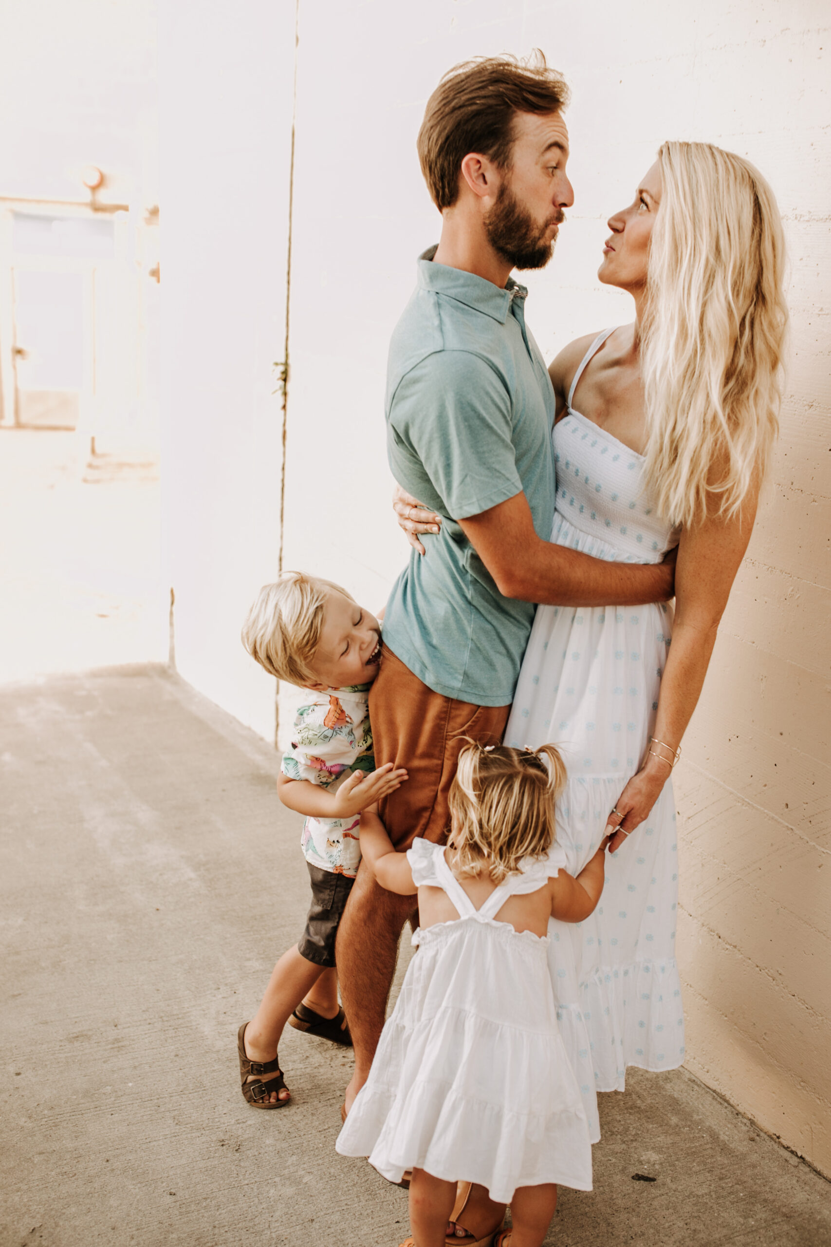 Family photos on the beach cool blue toned family photos San Diego photography family of four candid family moments family love beach family photos San Diego family photographer Sabrinalynnphoto