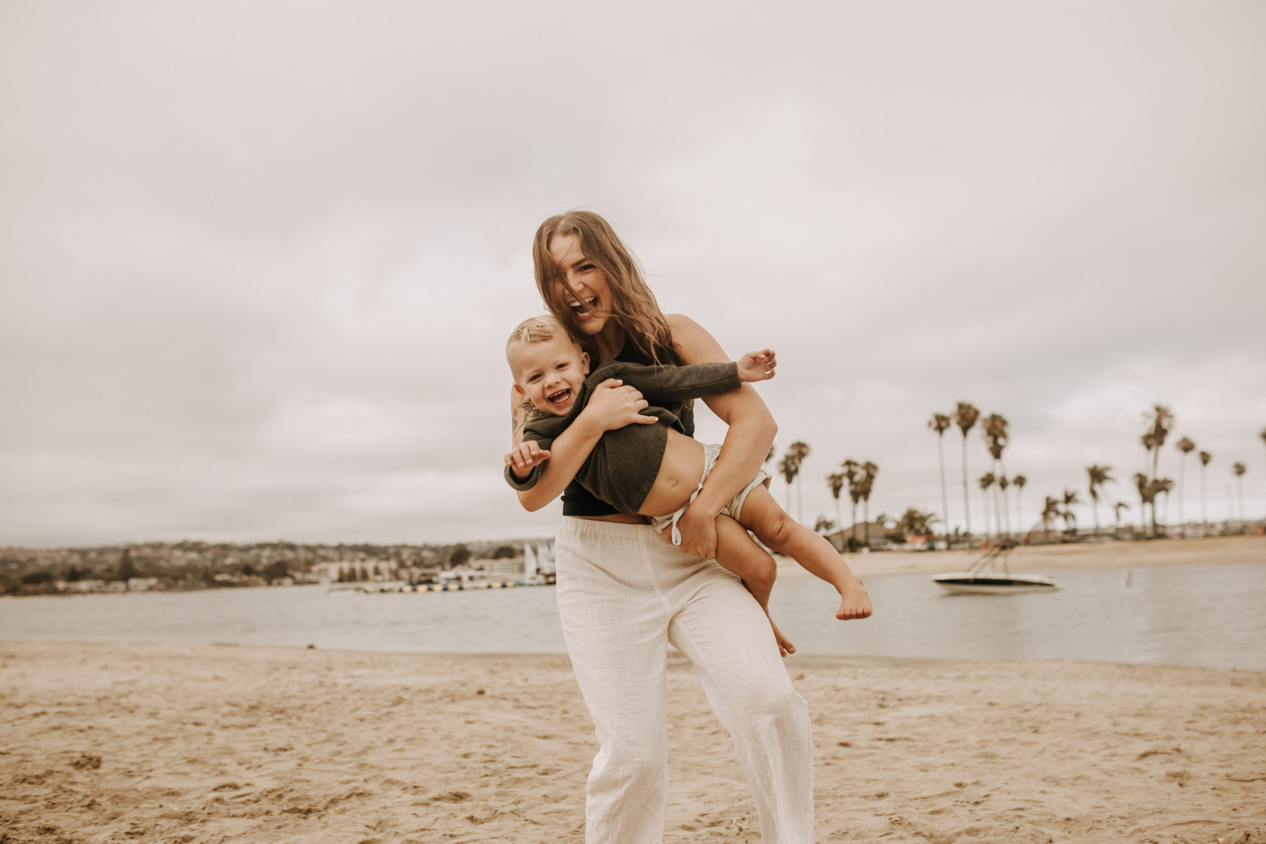 large family beach session family photos on the beach cloudy day big family great grand children San Diego family photographer