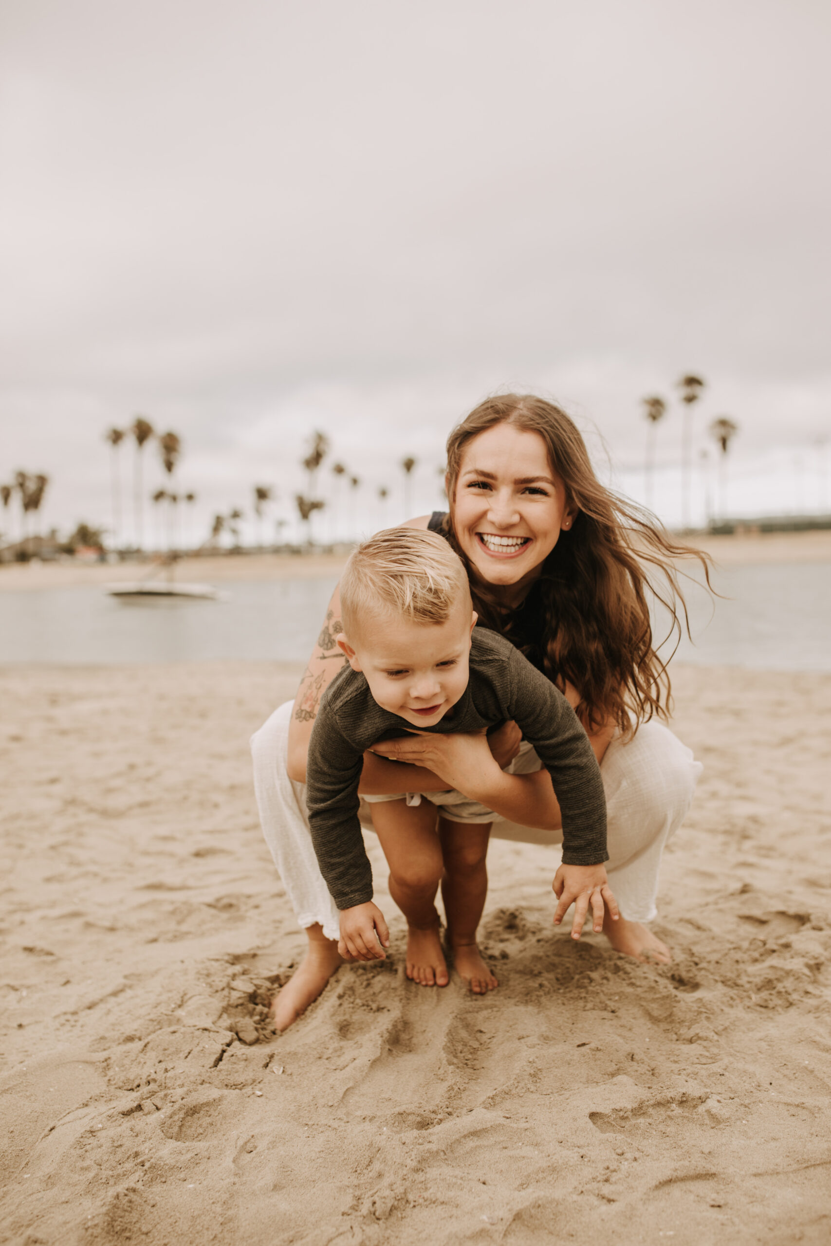 large family beach session family photos on the beach cloudy day big family great grand children San Diego family photographer