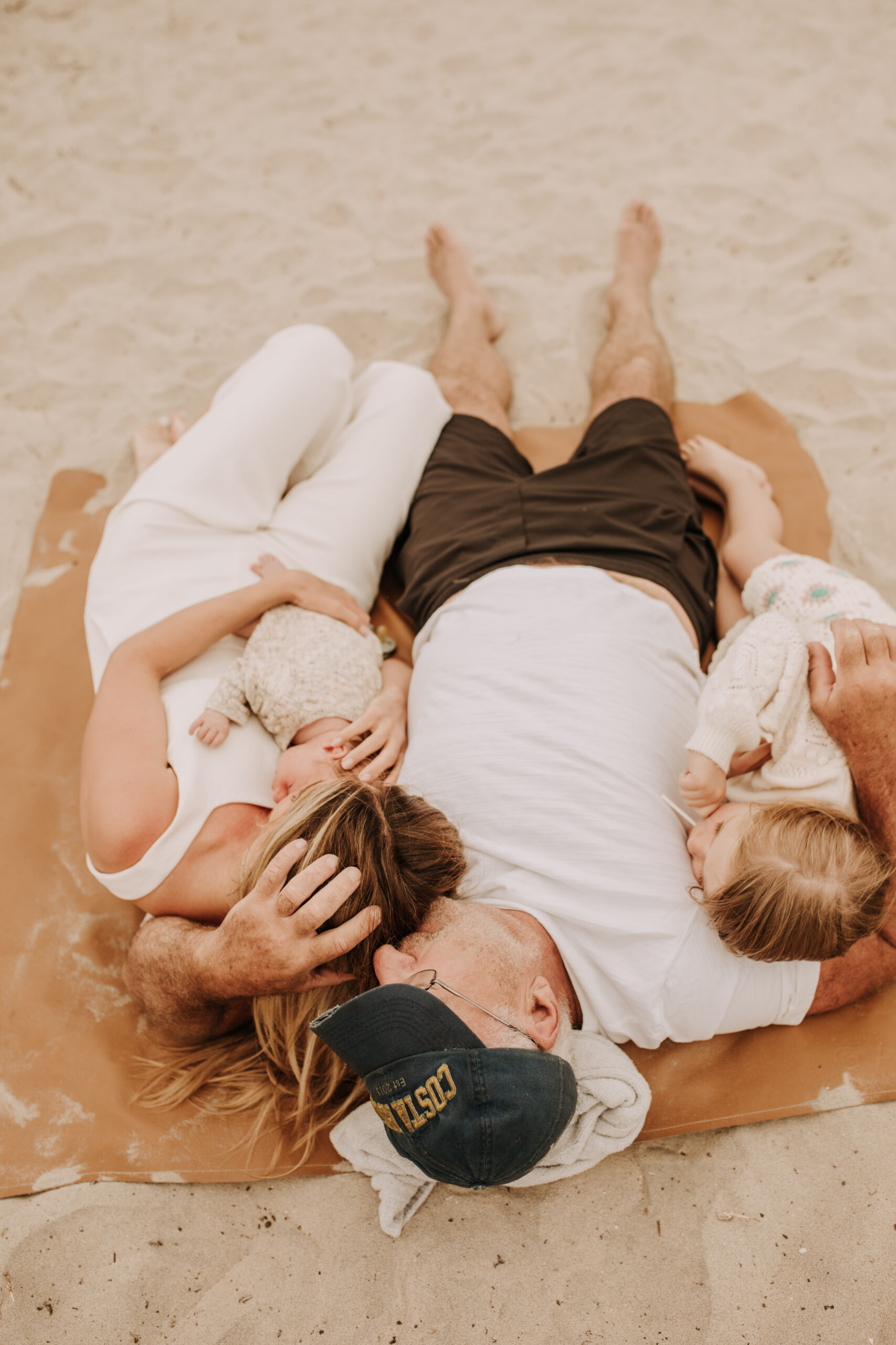 warm toned neutral color outdoor family photos beach day family photos newborn photos infant family cloudy day san digo family photographer Sabrina Kinsella