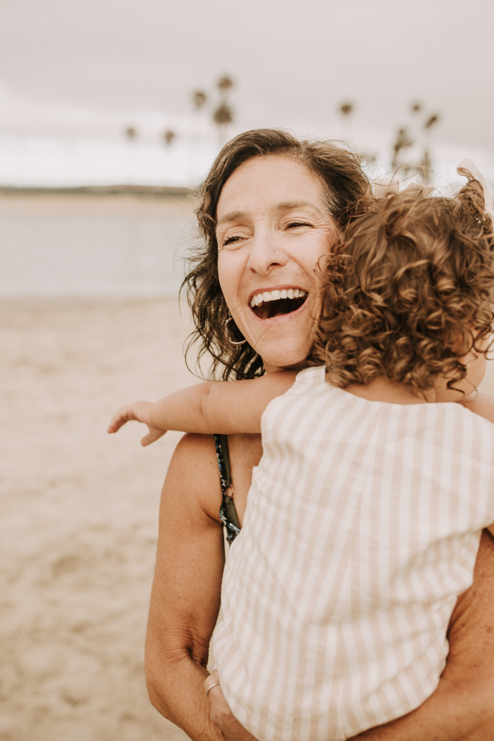 large family beach session family photos on the beach cloudy day big family great grand children San Diego family photographer