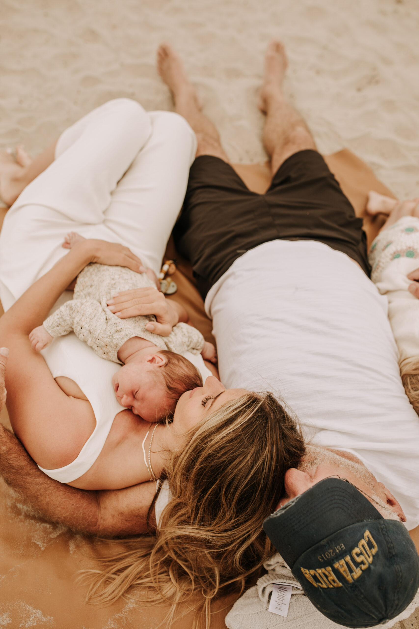 warm toned neutral color outdoor family photos beach day family photos newborn photos infant family cloudy day san digo family photographer Sabrina Kinsella