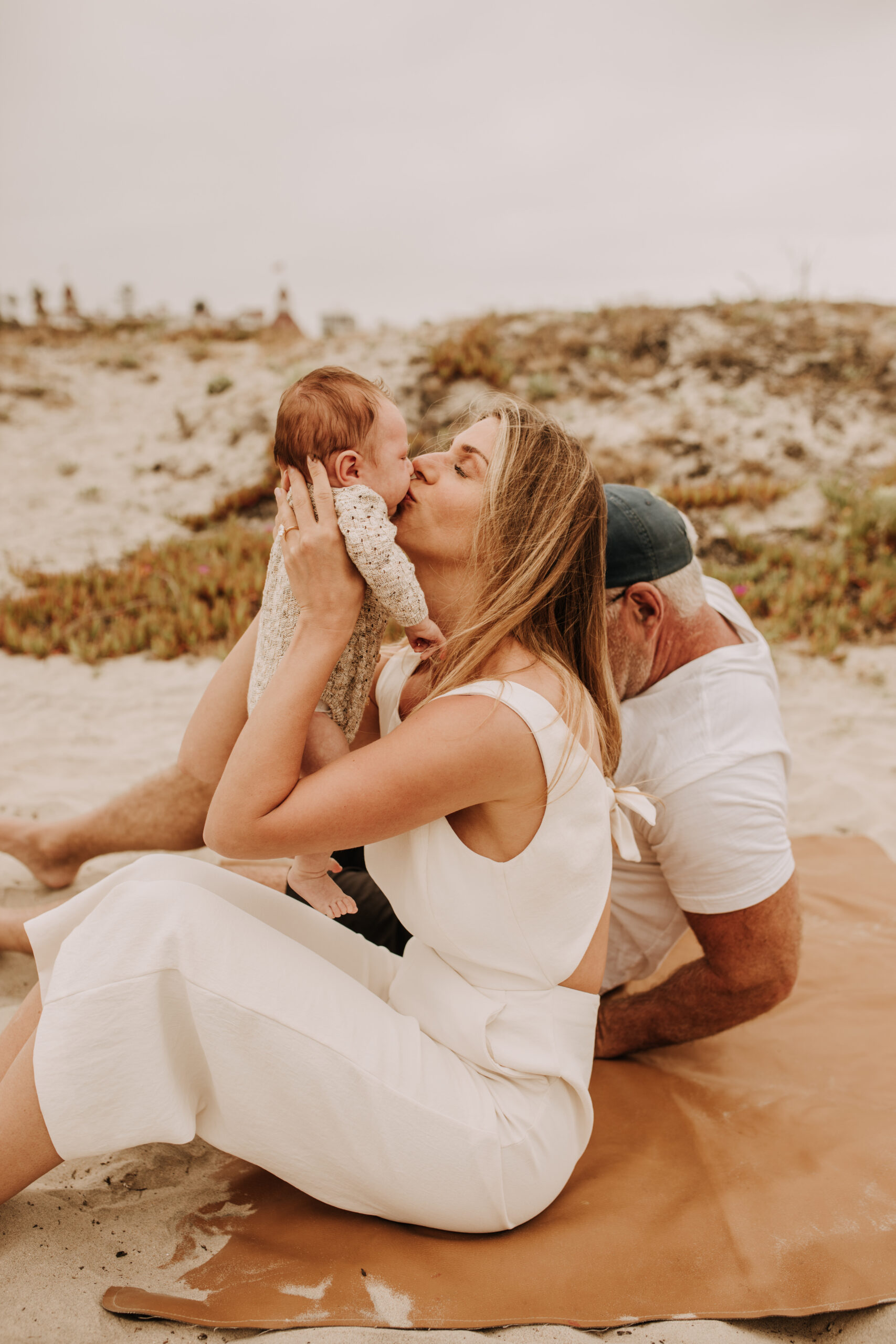 warm toned neutral color outdoor family photos beach day family photos newborn photos infant family cloudy day san digo family photographer Sabrina Kinsella