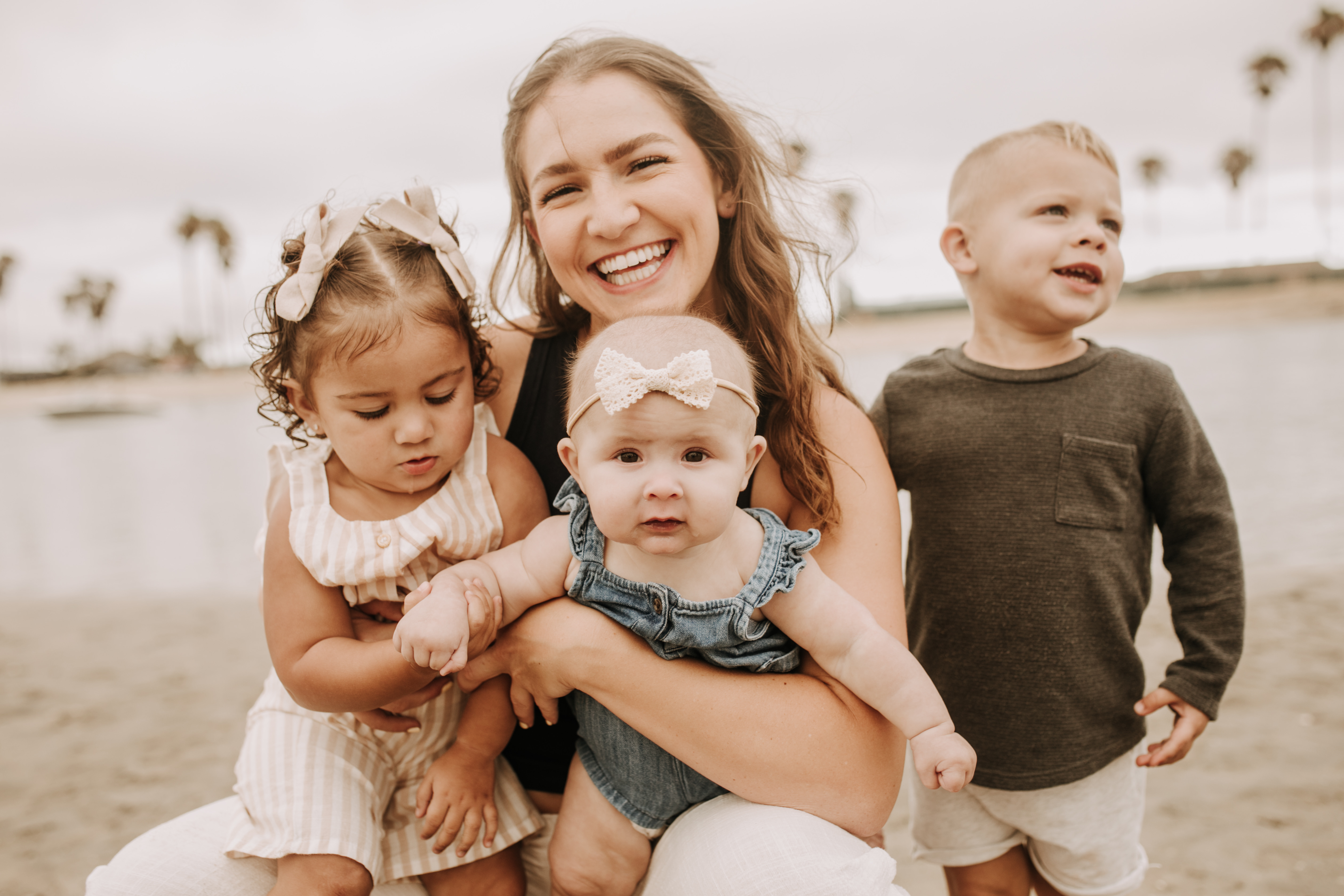 large family beach session family photos on the beach cloudy day big family great grand children San Diego family photographer