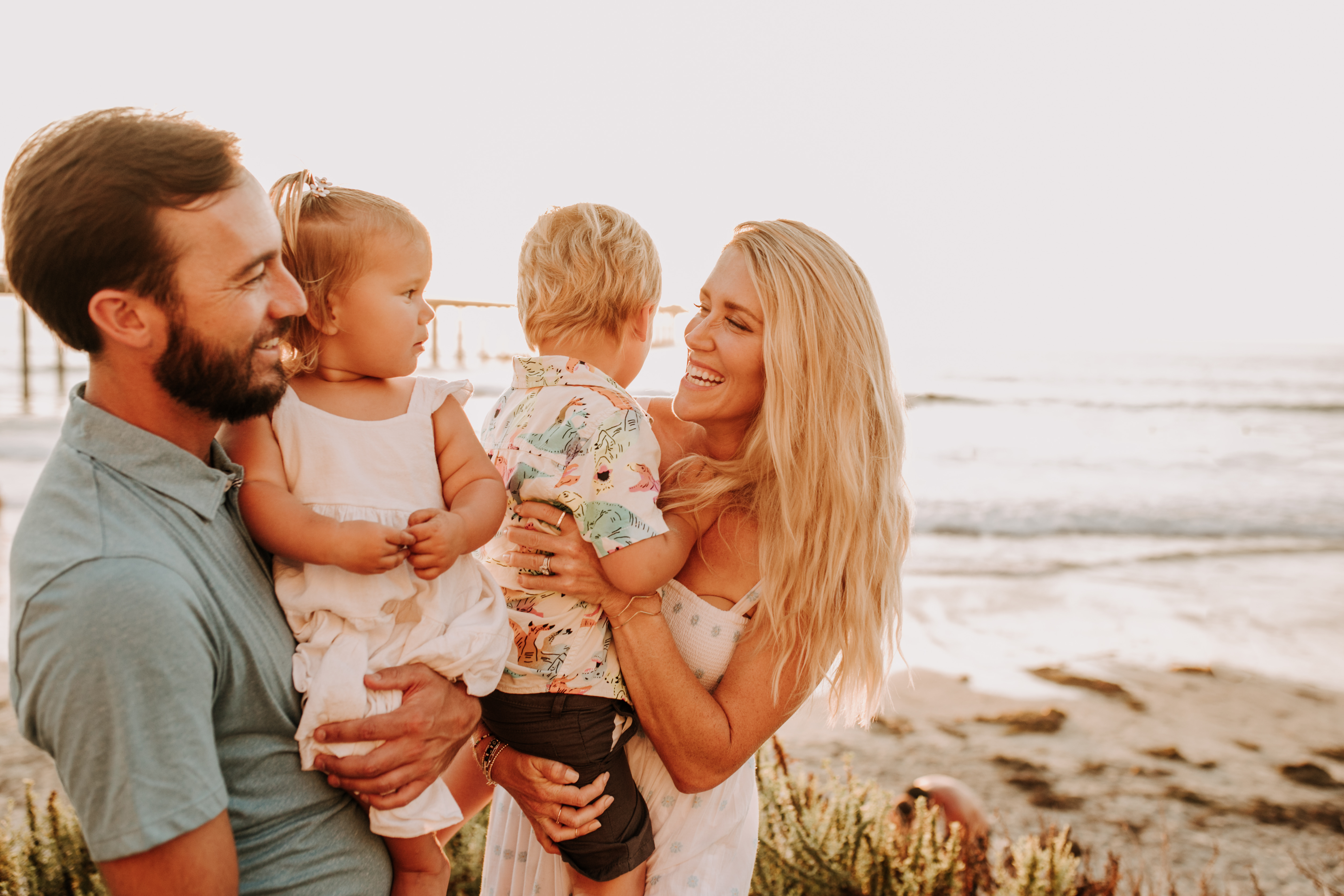 Family photos on the beach cool blue toned family photos San Diego photography family of four candid family moments family love beach family photos San Diego family photographer Sabrinalynnphoto