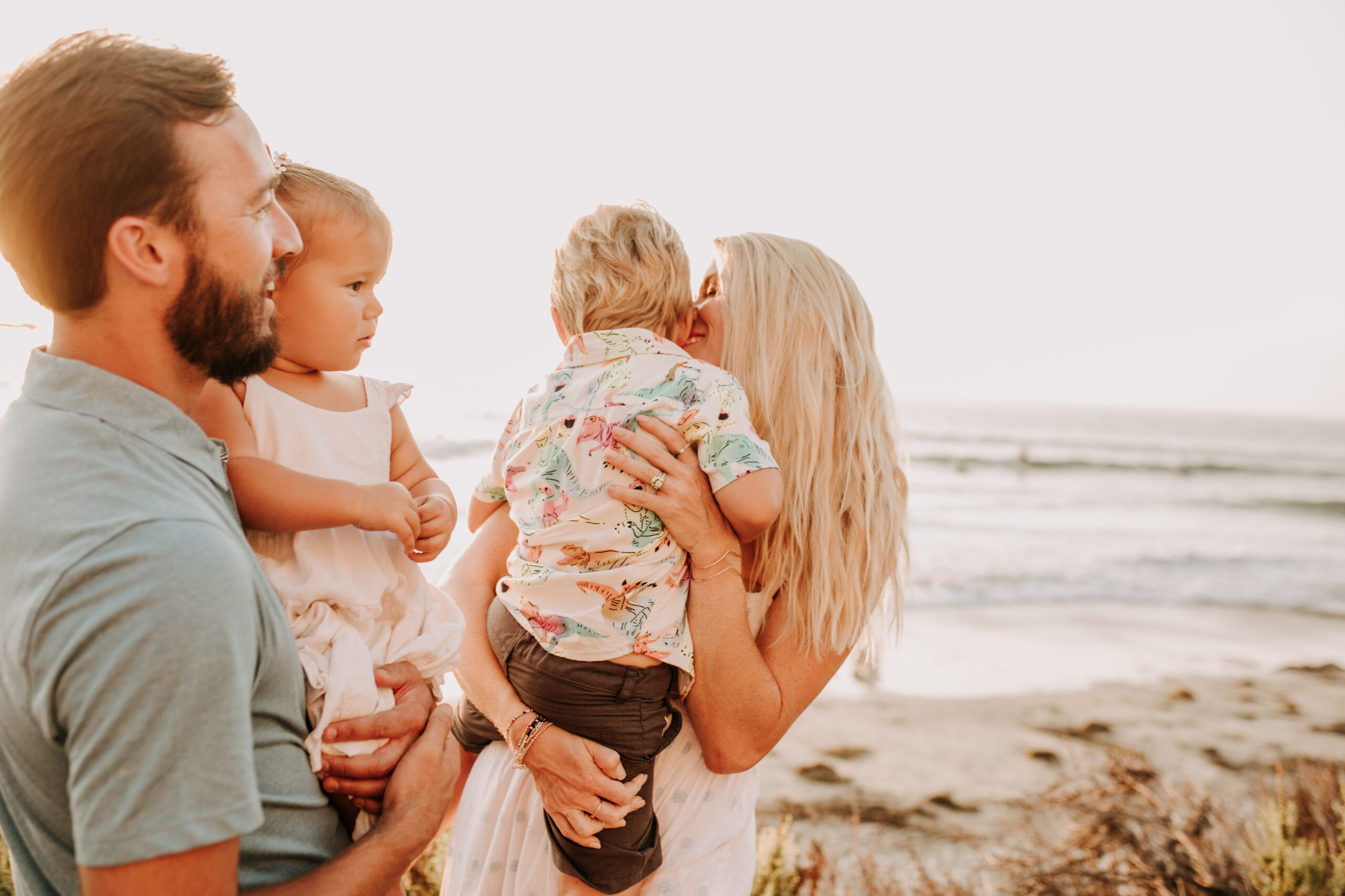 Family photos on the beach cool blue toned family photos San Diego photography family of four candid family moments family love beach family photos San Diego family photographer Sabrinalynnphoto