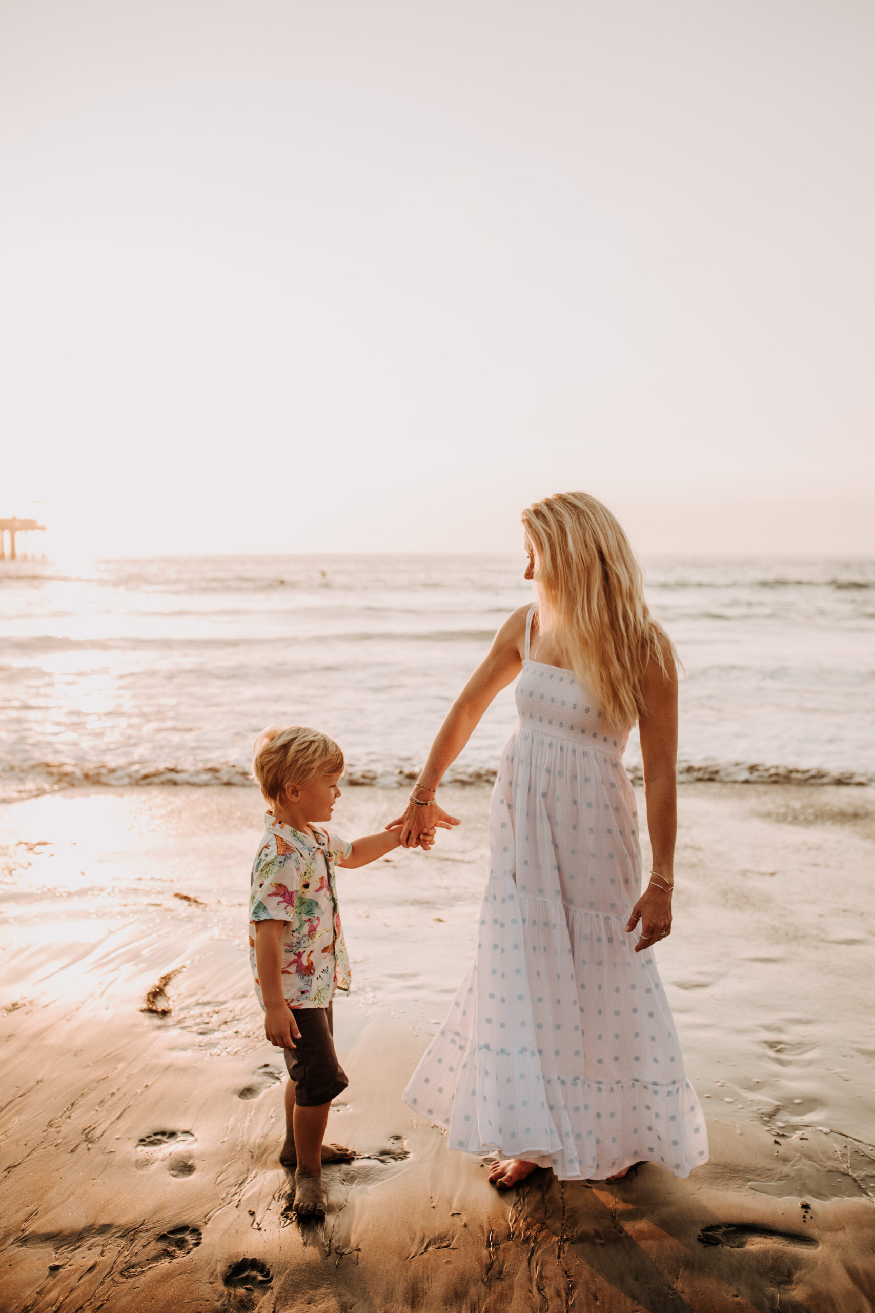 Family photos on the beach cool blue toned family photos San Diego photography family of four candid family moments family love beach family photos San Diego family photographer Sabrinalynnphoto