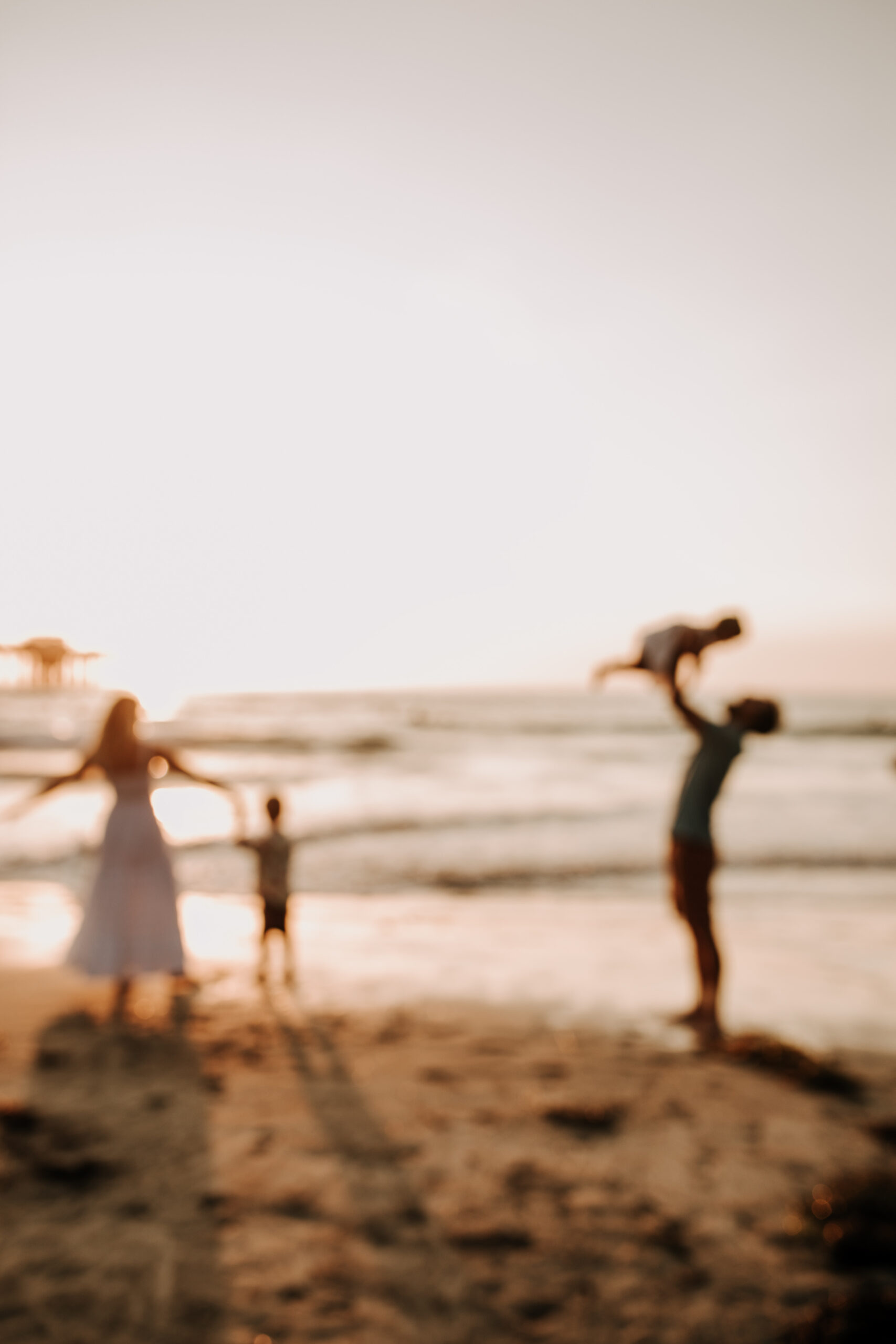 Family photos on the beach cool blue toned family photos San Diego photography family of four candid family moments family love beach family photos San Diego family photographer Sabrinalynnphoto