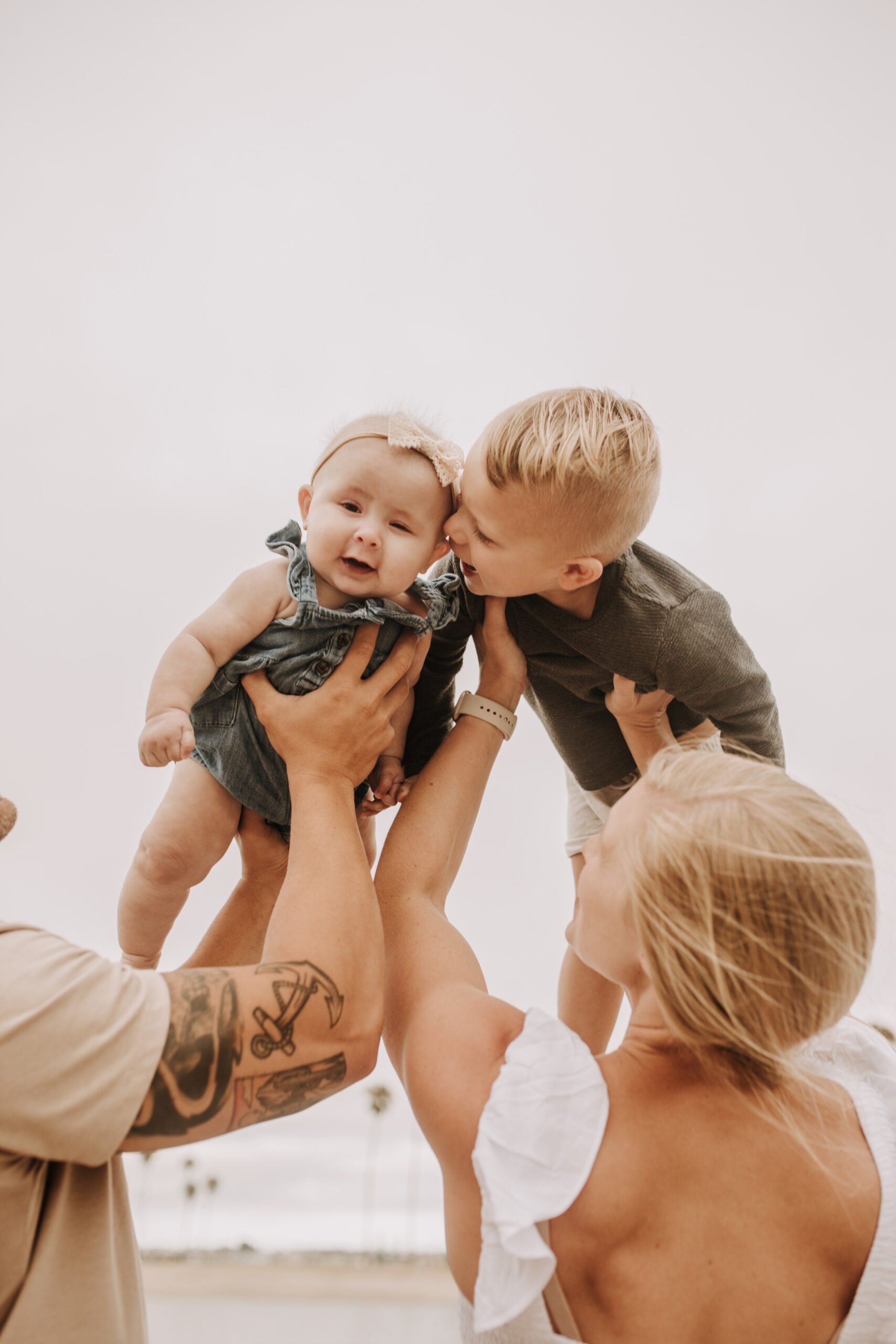 large family beach session family photos on the beach cloudy day big family great grand children San Diego family photographer