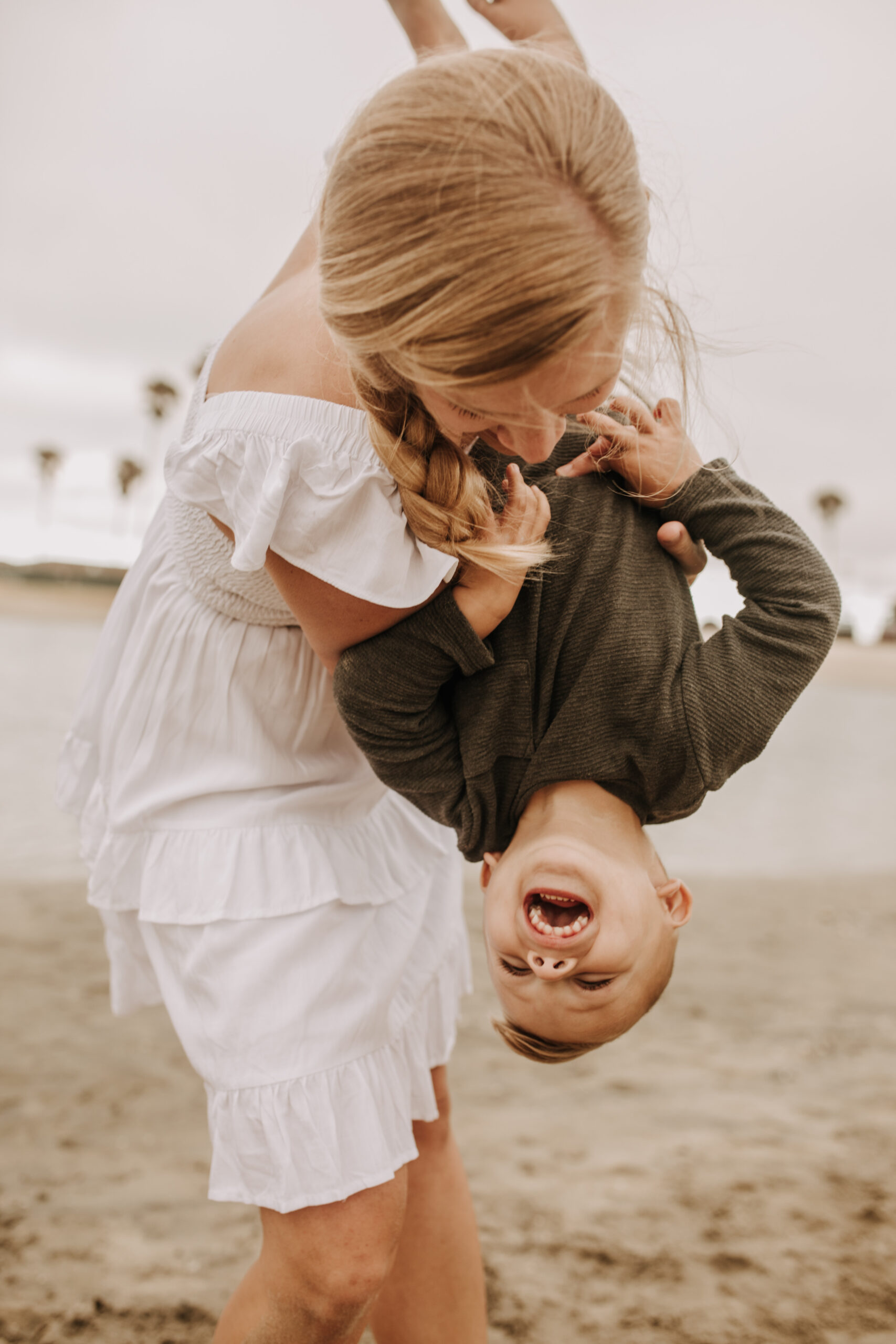 large family beach session family photos on the beach cloudy day big family great grand children San Diego family photographer