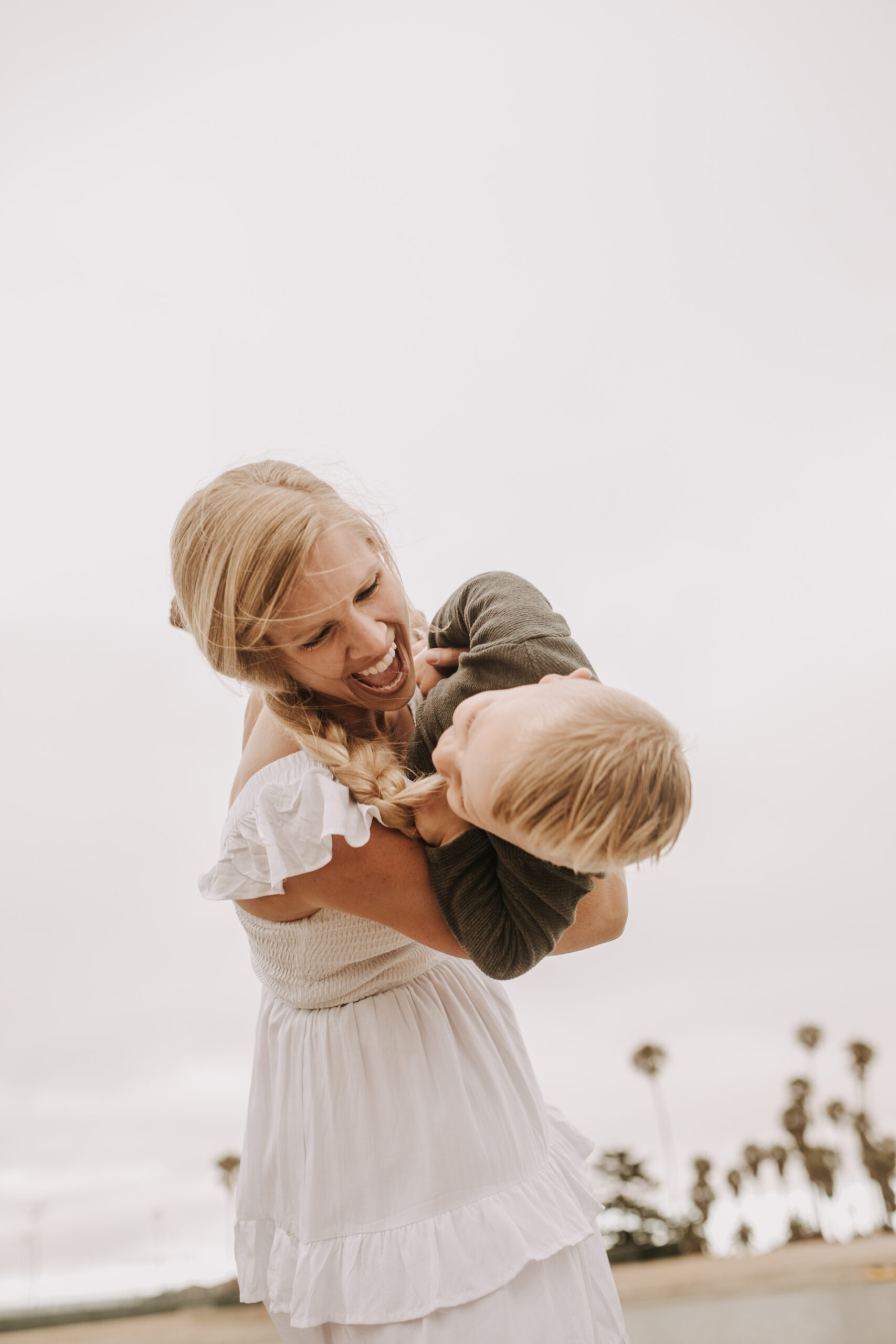 large family beach session family photos on the beach cloudy day big family great grand children San Diego family photographer