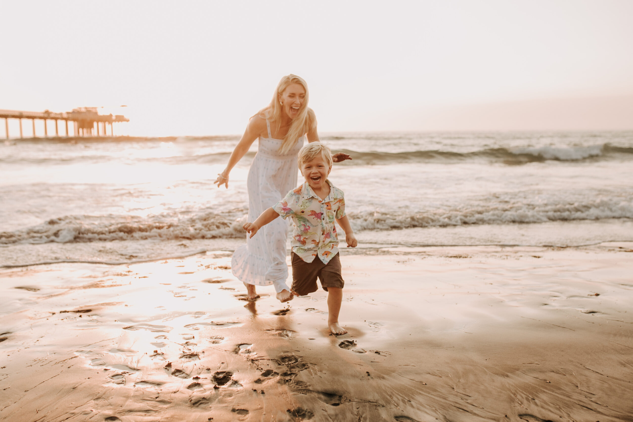 Family photos on the beach cool blue toned family photos San Diego photography family of four candid family moments family love beach family photos San Diego family photographer Sabrinalynnphoto