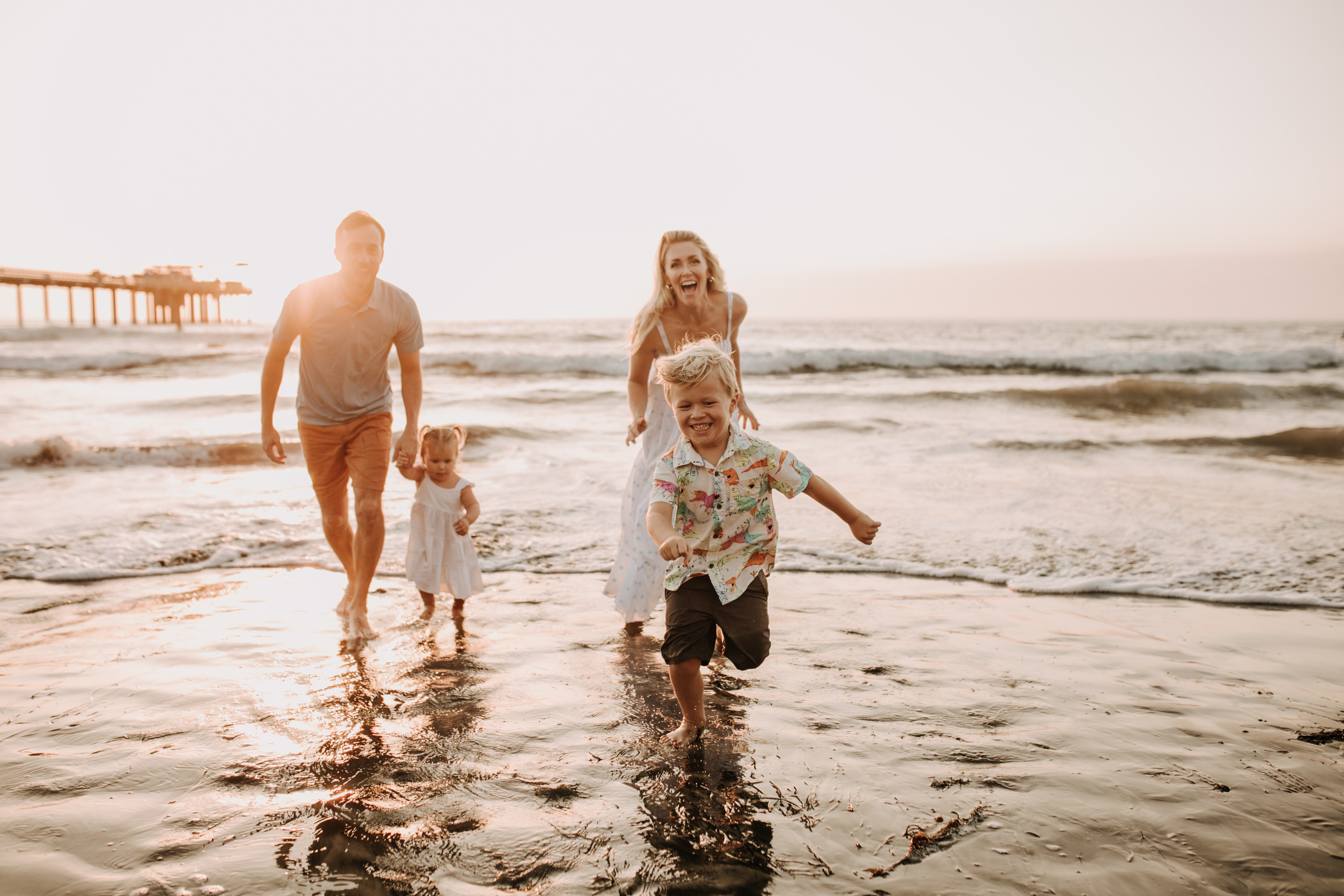 Family photos on the beach cool blue toned family photos San Diego photography family of four candid family moments family love beach family photos San Diego family photographer Sabrinalynnphoto