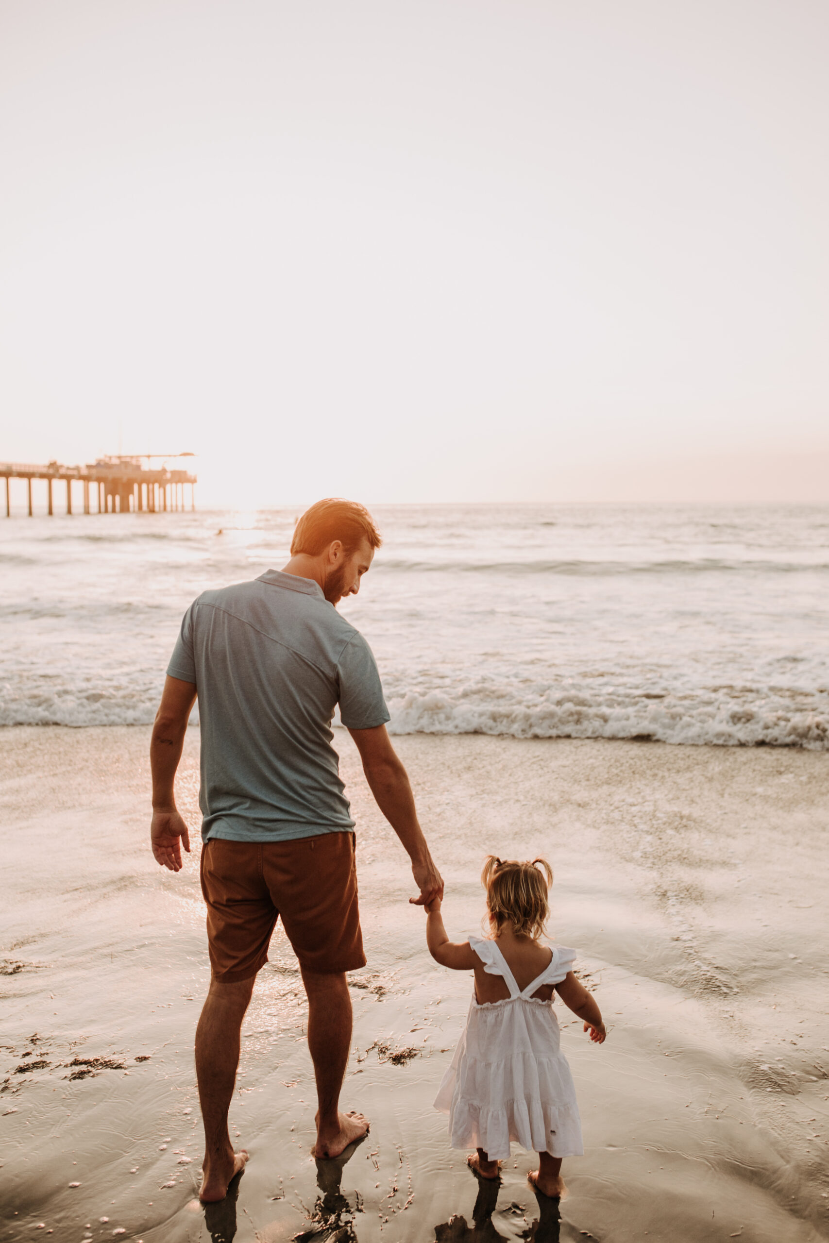 Family photos on the beach cool blue toned family photos San Diego photography family of four candid family moments family love beach family photos San Diego family photographer Sabrinalynnphoto