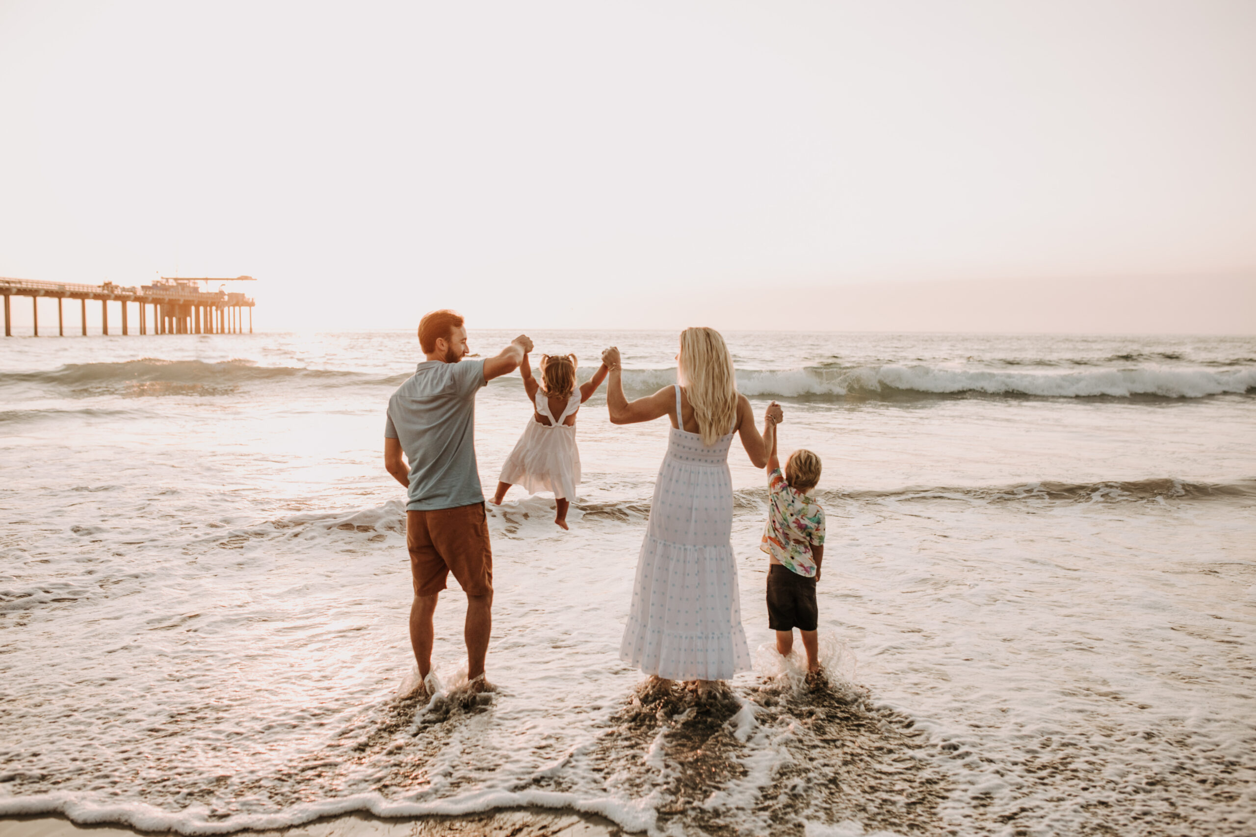 Family photos on the beach cool blue toned family photos San Diego photography family of four candid family moments family love beach family photos San Diego family photographer Sabrinalynnphoto