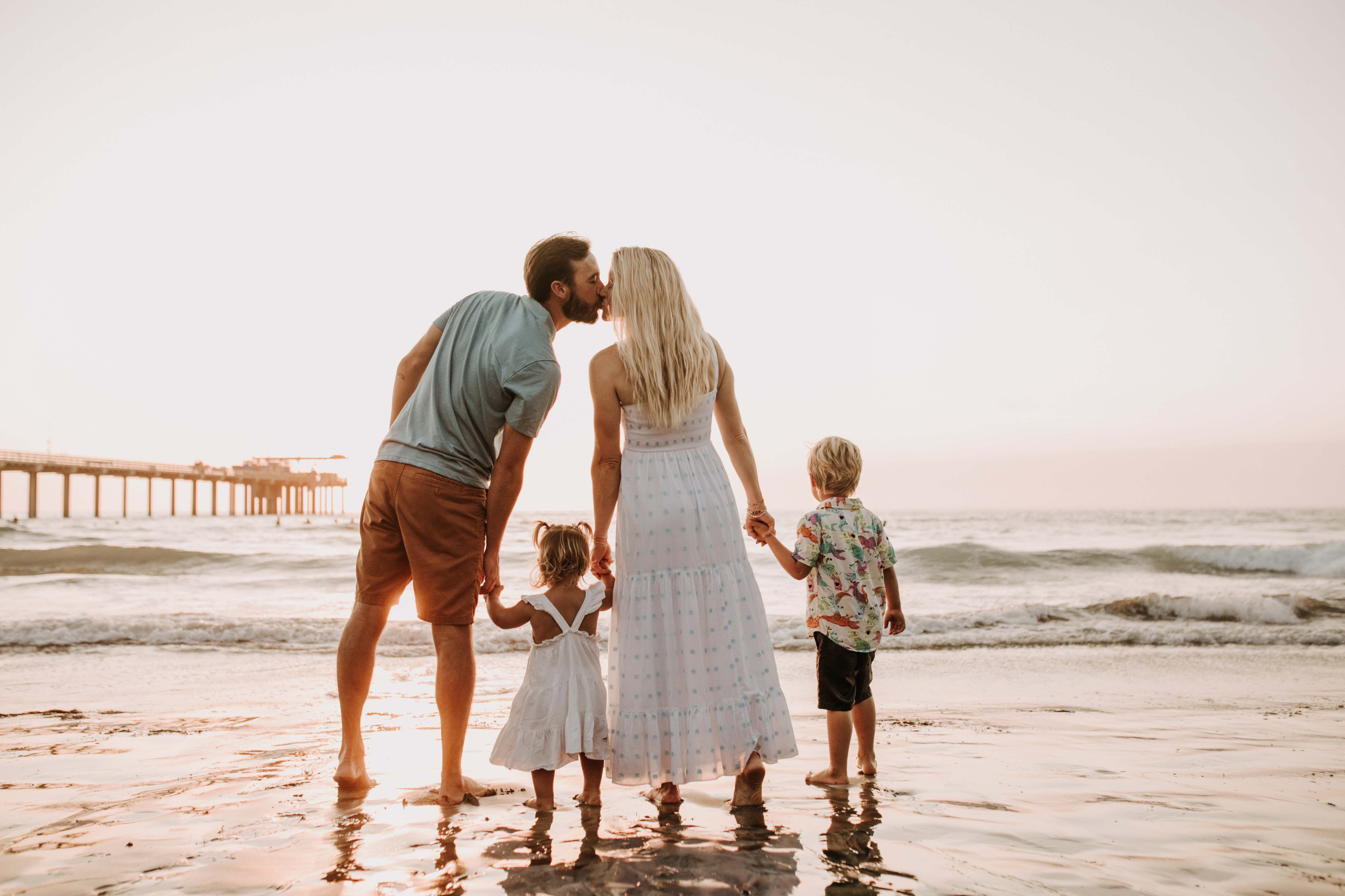 Family photos on the beach cool blue toned family photos San Diego photography family of four candid family moments family love beach family photos San Diego family photographer Sabrinalynnphoto