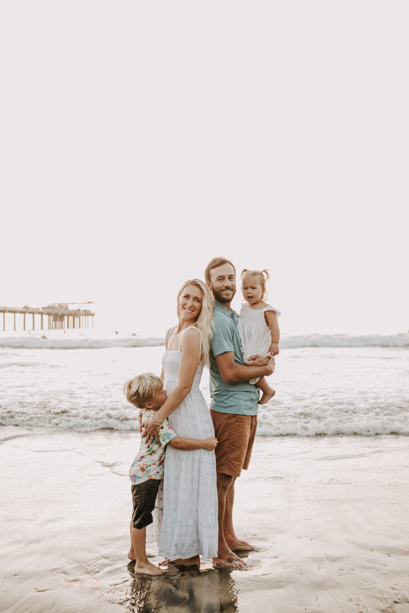 Family photos on the beach cool blue toned family photos San Diego photography family of four candid family moments family love beach family photos San Diego family photographer Sabrinalynnphoto