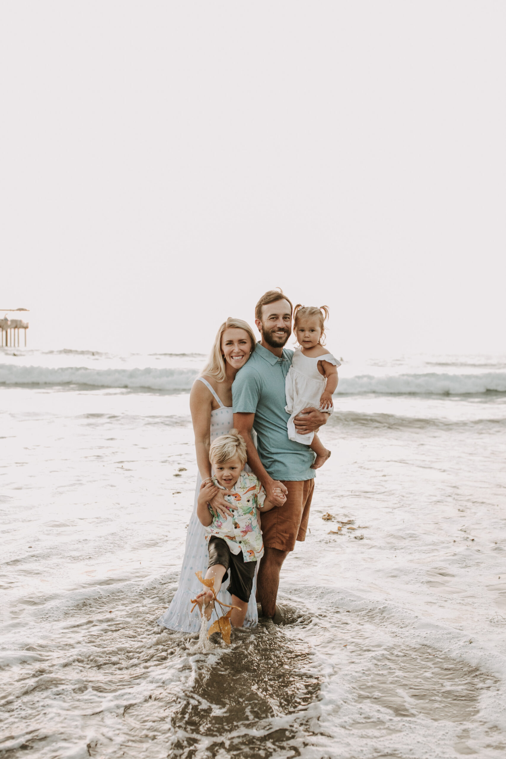 Family photos on the beach cool blue toned family photos San Diego photography family of four candid family moments family love beach family photos San Diego family photographer Sabrinalynnphoto