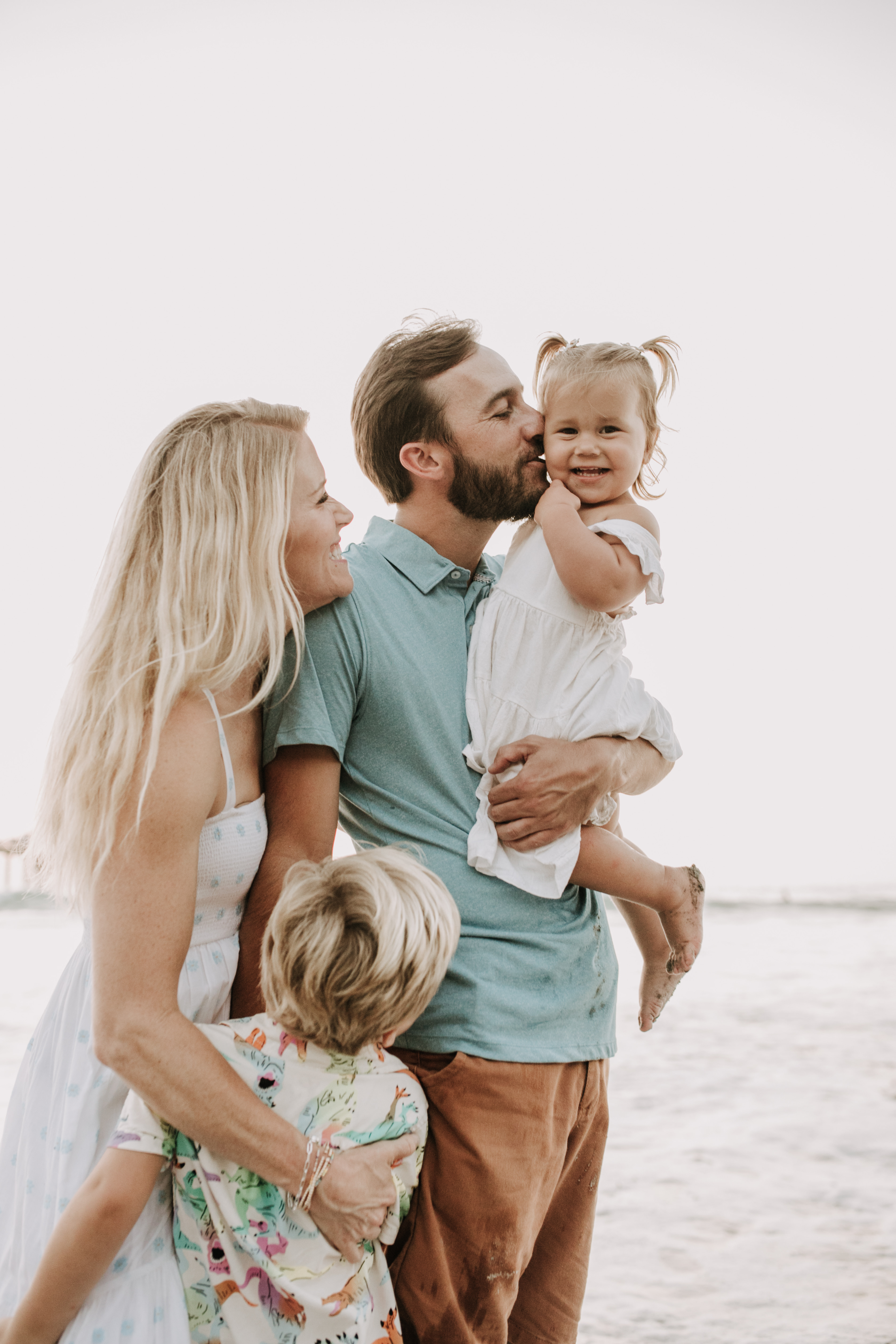 Family photos on the beach cool blue toned family photos San Diego photography family of four candid family moments family love beach family photos San Diego family photographer Sabrinalynnphoto