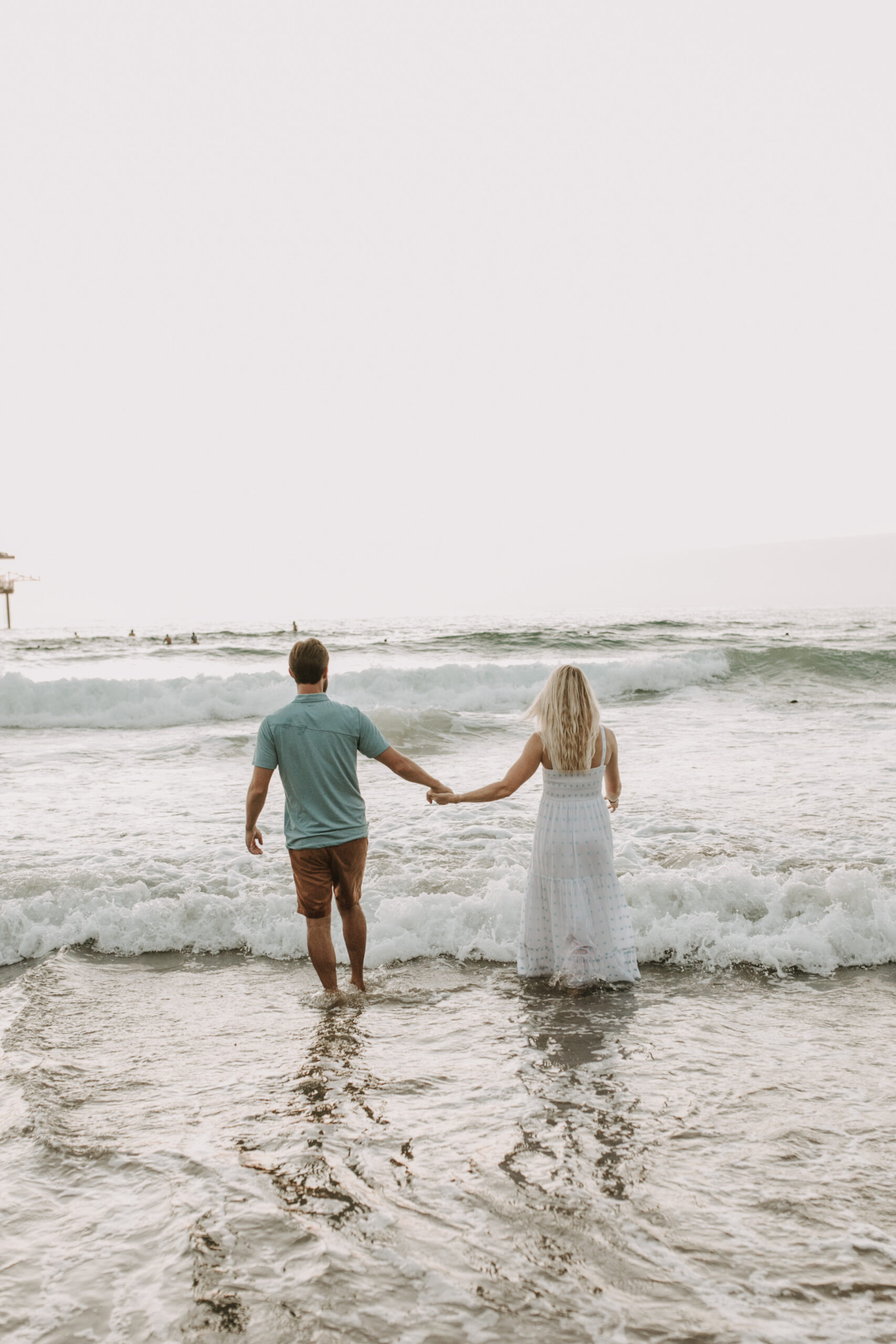 Family photos on the beach cool blue toned family photos San Diego photography family of four candid family moments family love beach family photos San Diego family photographer Sabrinalynnphoto