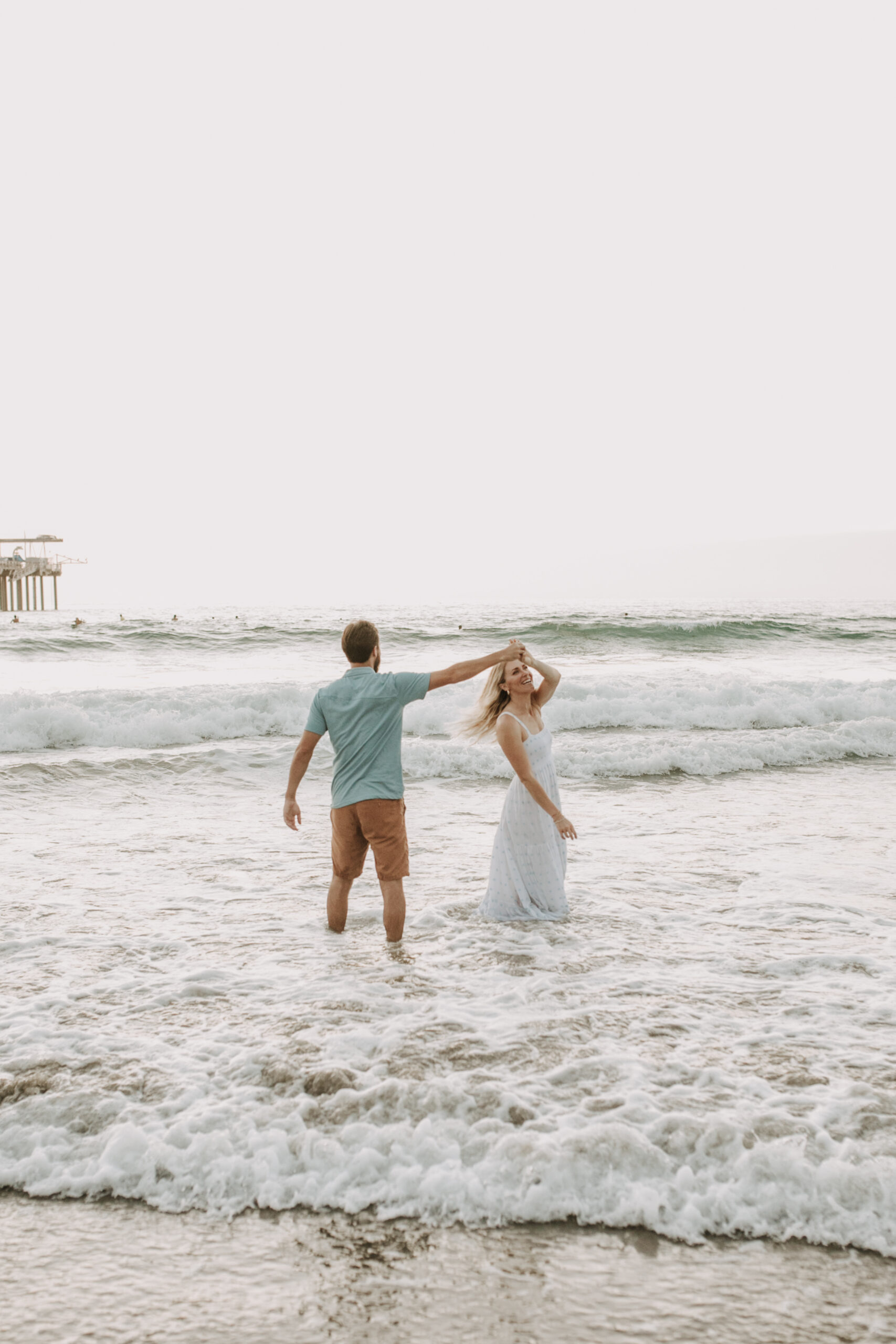 Family photos on the beach cool blue toned family photos San Diego photography family of four candid family moments family love beach family photos San Diego family photographer Sabrinalynnphoto