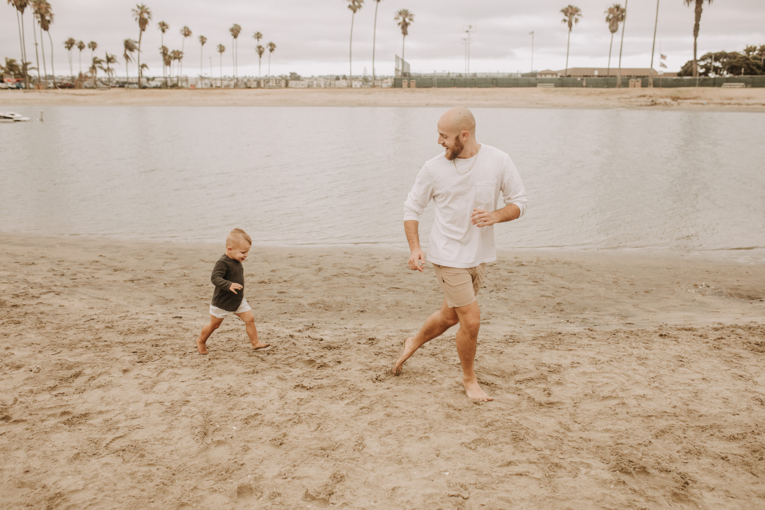 large family beach session family photos on the beach cloudy day big family great grand children San Diego family photographer