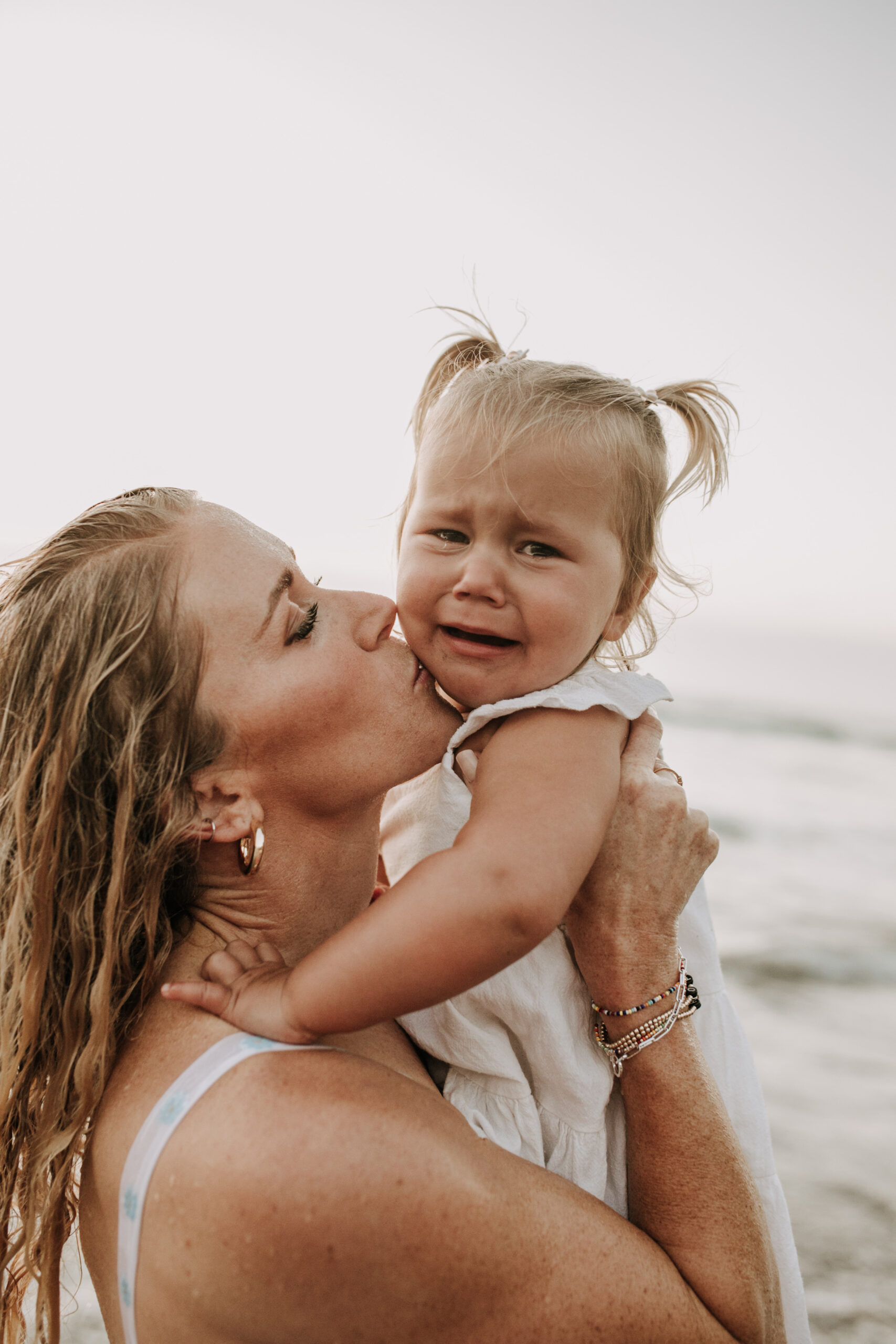 Family photos on the beach cool blue toned family photos San Diego photography family of four candid family moments family love beach family photos San Diego family photographer Sabrinalynnphoto