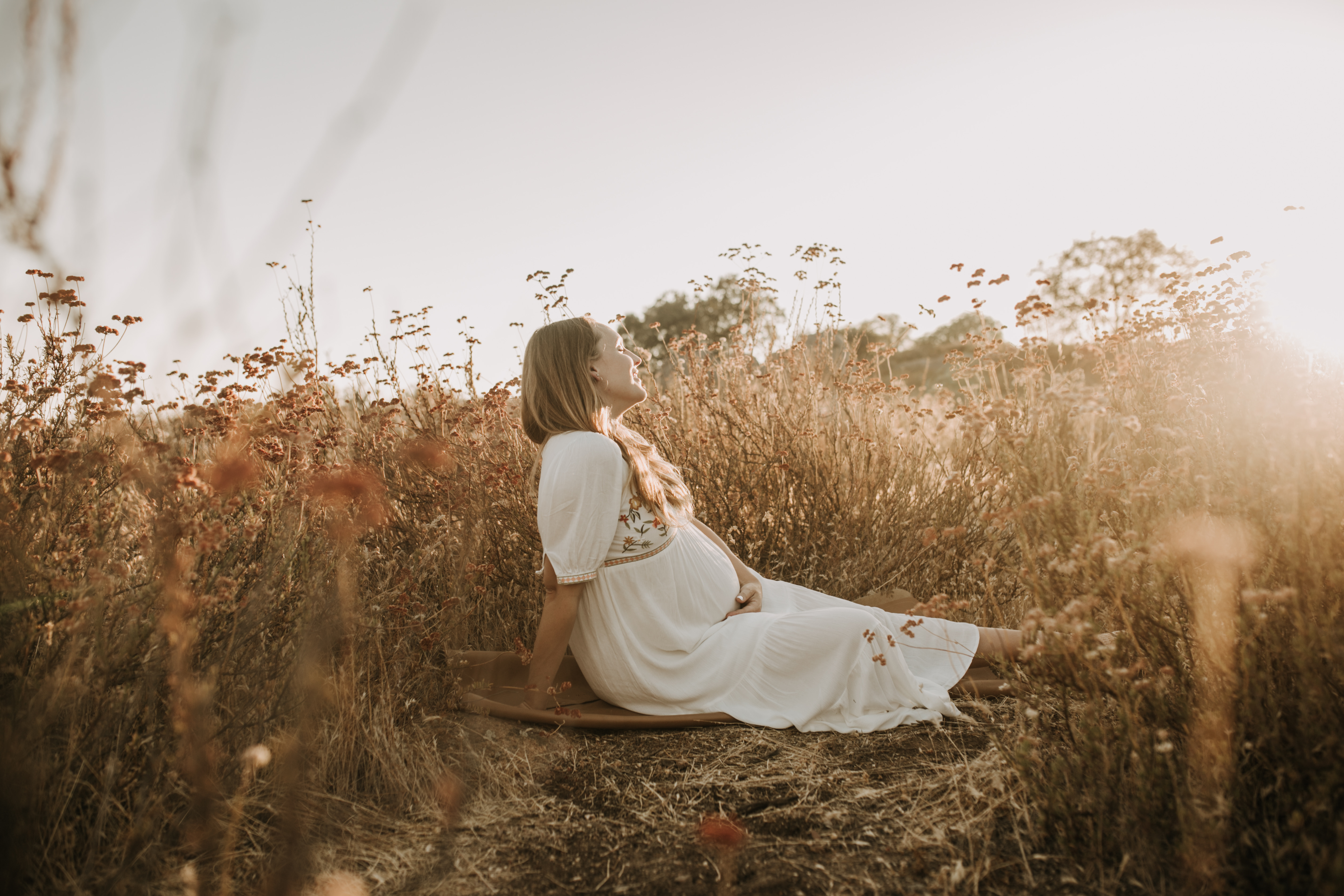 outdoor maternity photos warm and sunny maternity photos couples photos summer field white dress pregnancy San Diego photographer Sabrina kinsella