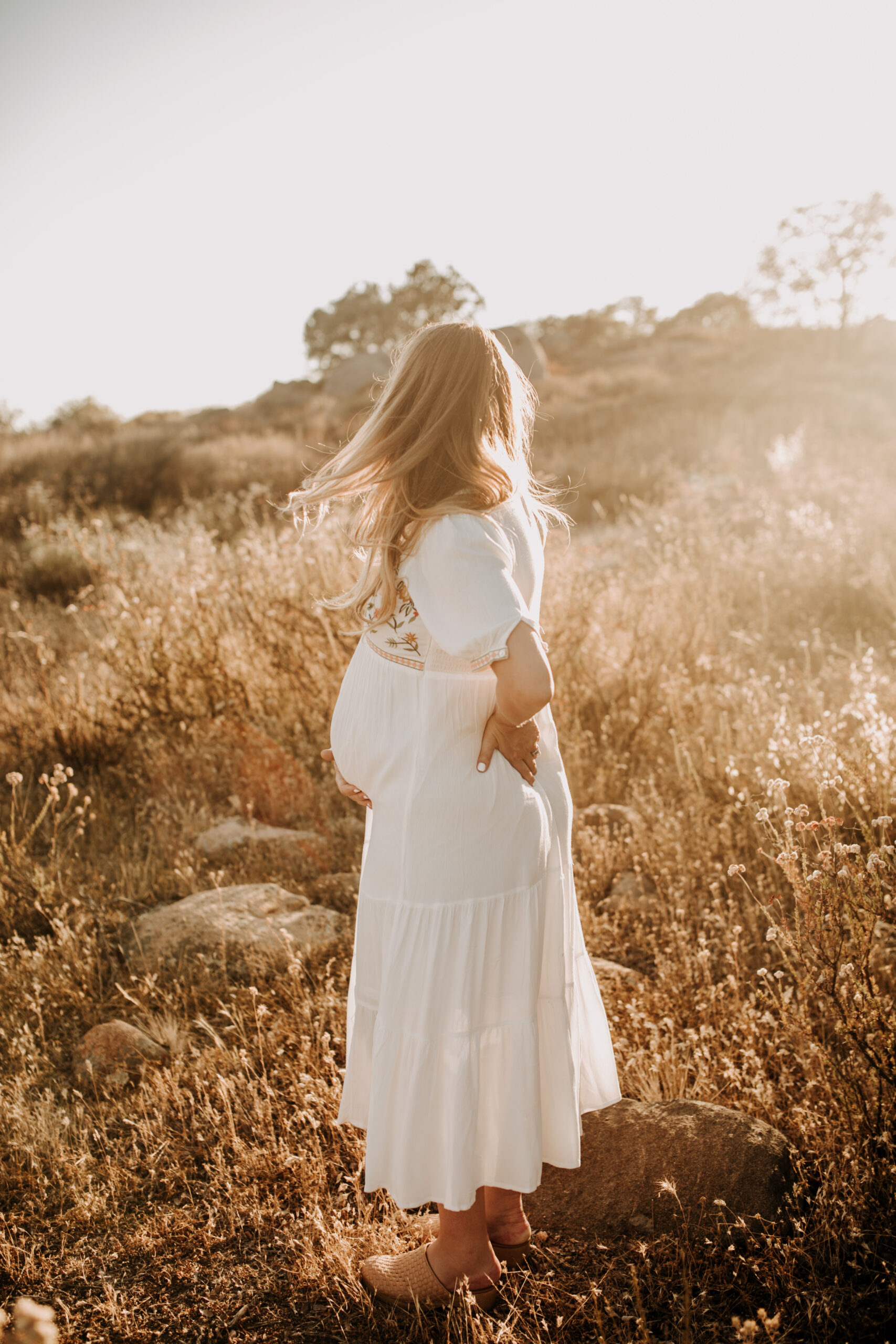 outdoor maternity photos warm and sunny maternity photos couples photos summer field white dress pregnancy San Diego photographer Sabrina kinsella