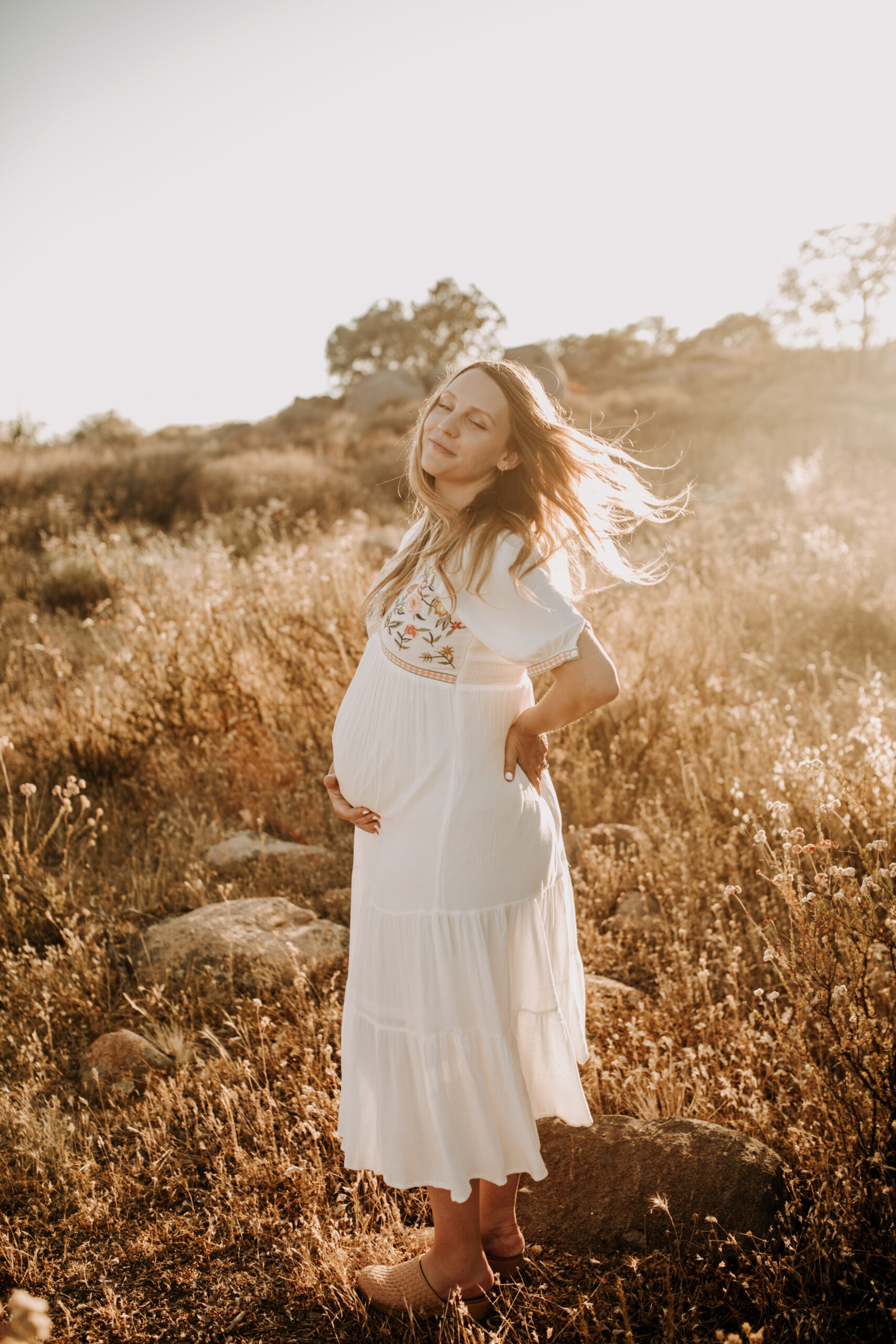 outdoor maternity photos warm and sunny maternity photos couples photos summer field white dress pregnancy San Diego photographer Sabrina kinsella