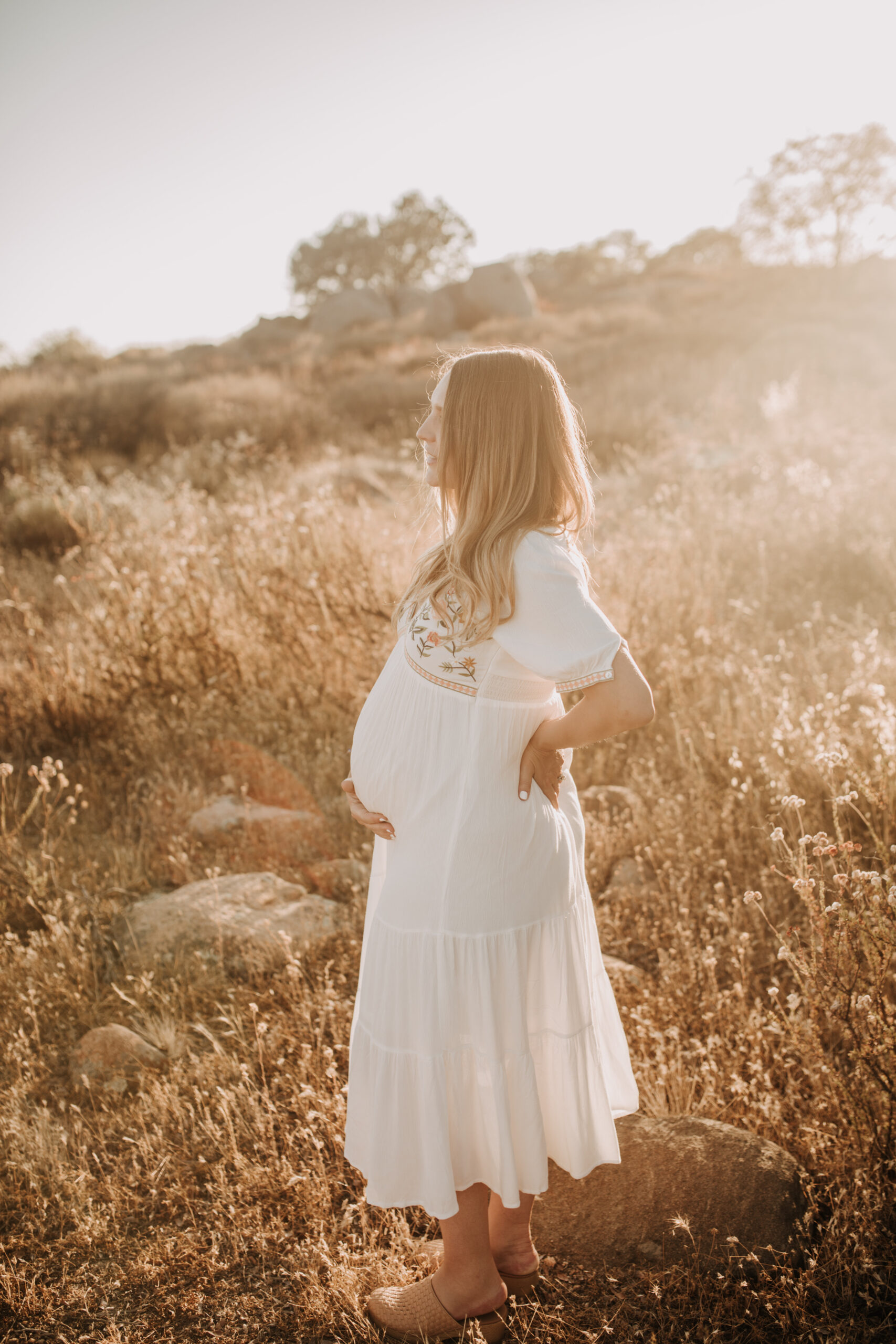 outdoor maternity photos warm and sunny maternity photos couples photos summer field white dress pregnancy San Diego photographer Sabrina kinsella