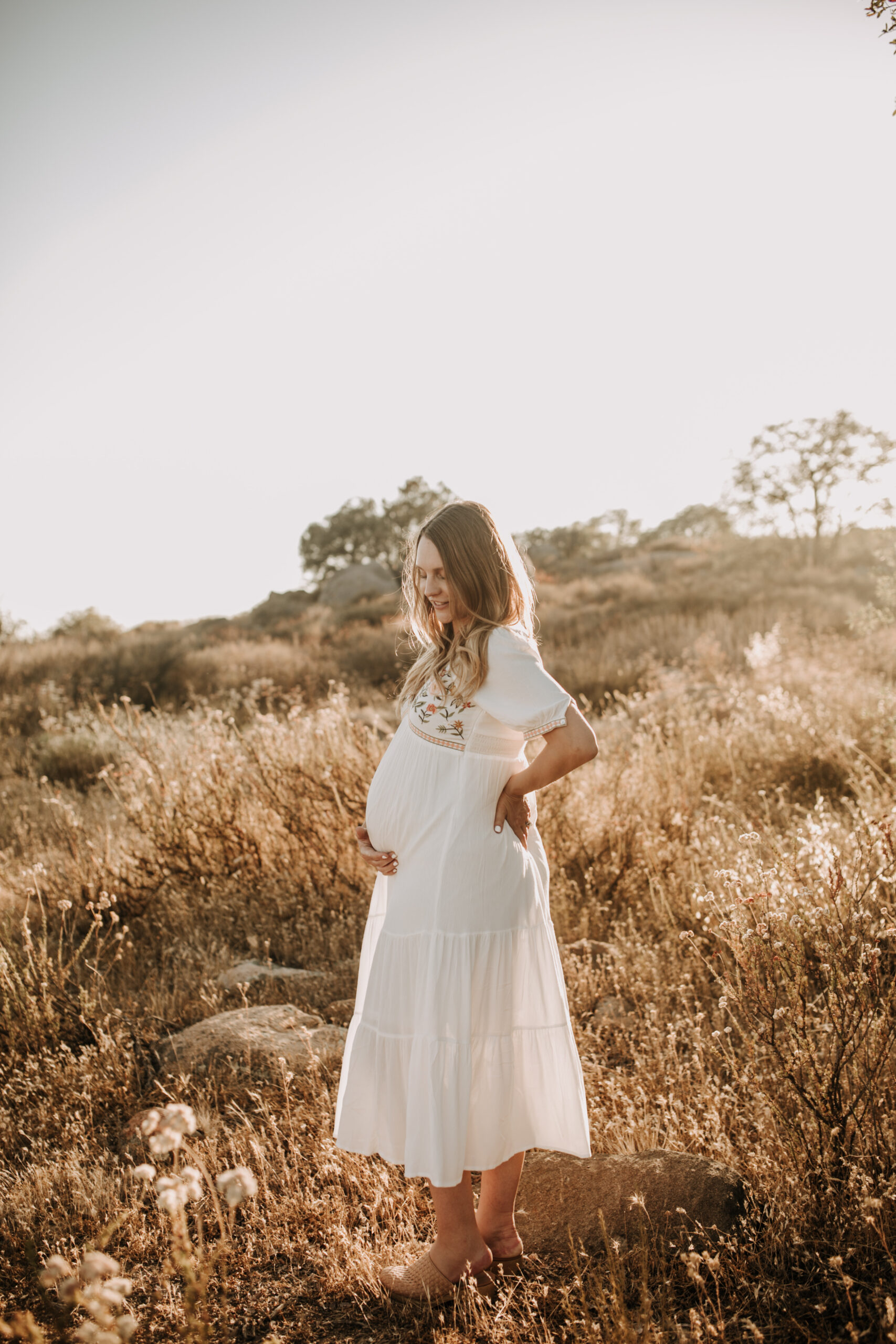 outdoor maternity photos warm and sunny maternity photos couples photos summer field white dress pregnancy San Diego photographer Sabrina kinsella