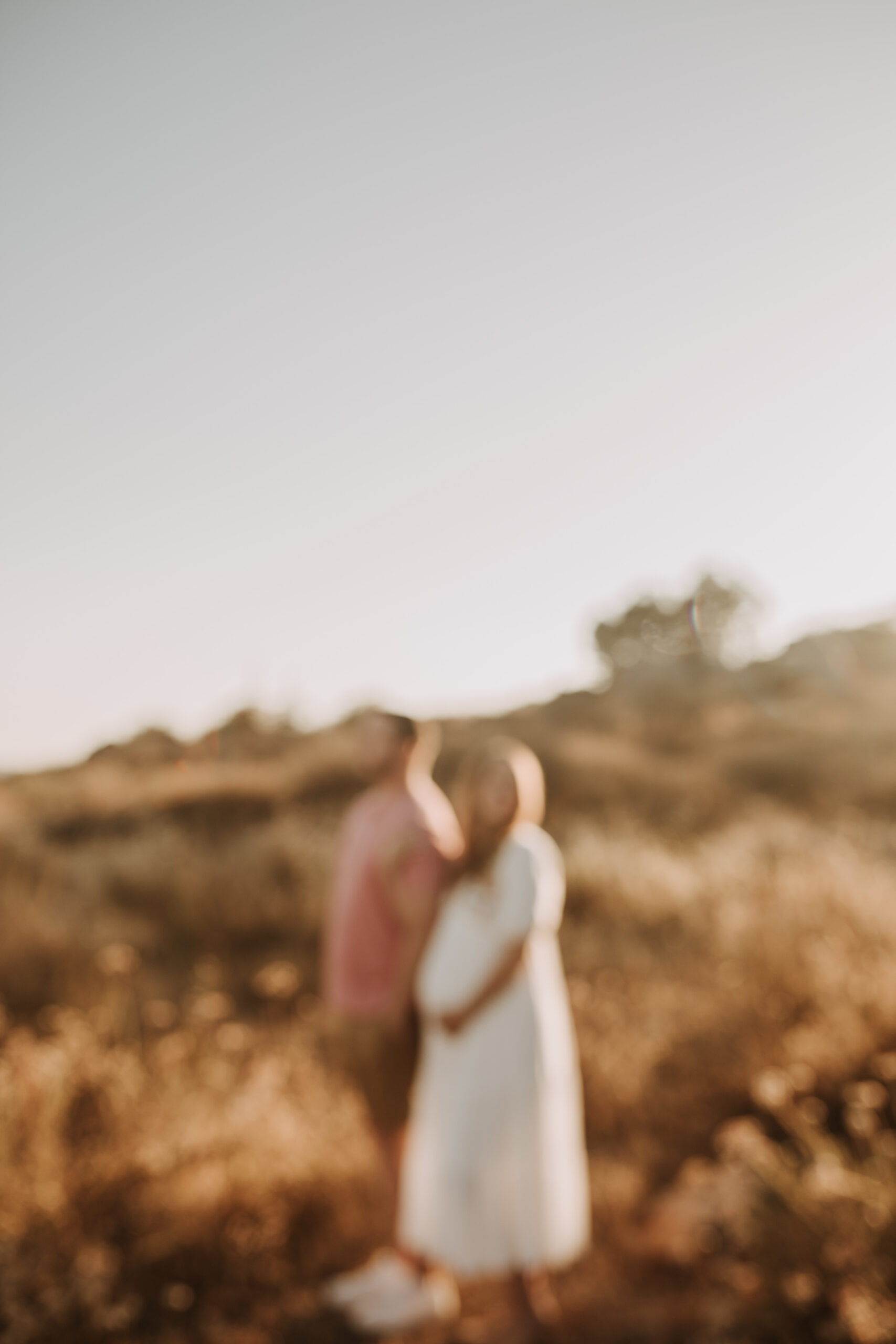 outdoor maternity photos warm and sunny maternity photos couples photos summer field white dress pregnancy San Diego photographer Sabrina kinsella