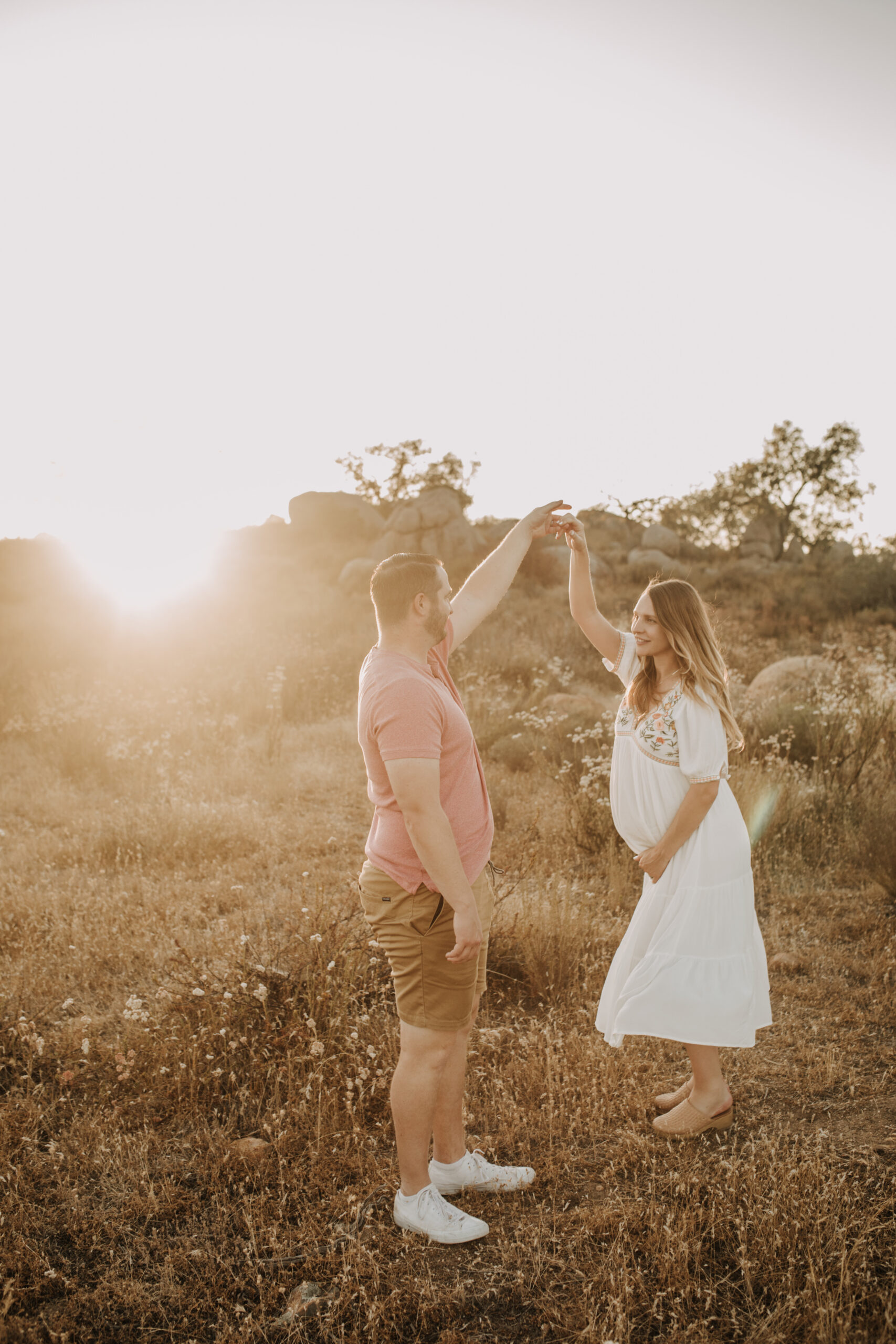 outdoor maternity photos warm and sunny maternity photos couples photos summer field white dress pregnancy San Diego photographer Sabrina kinsella