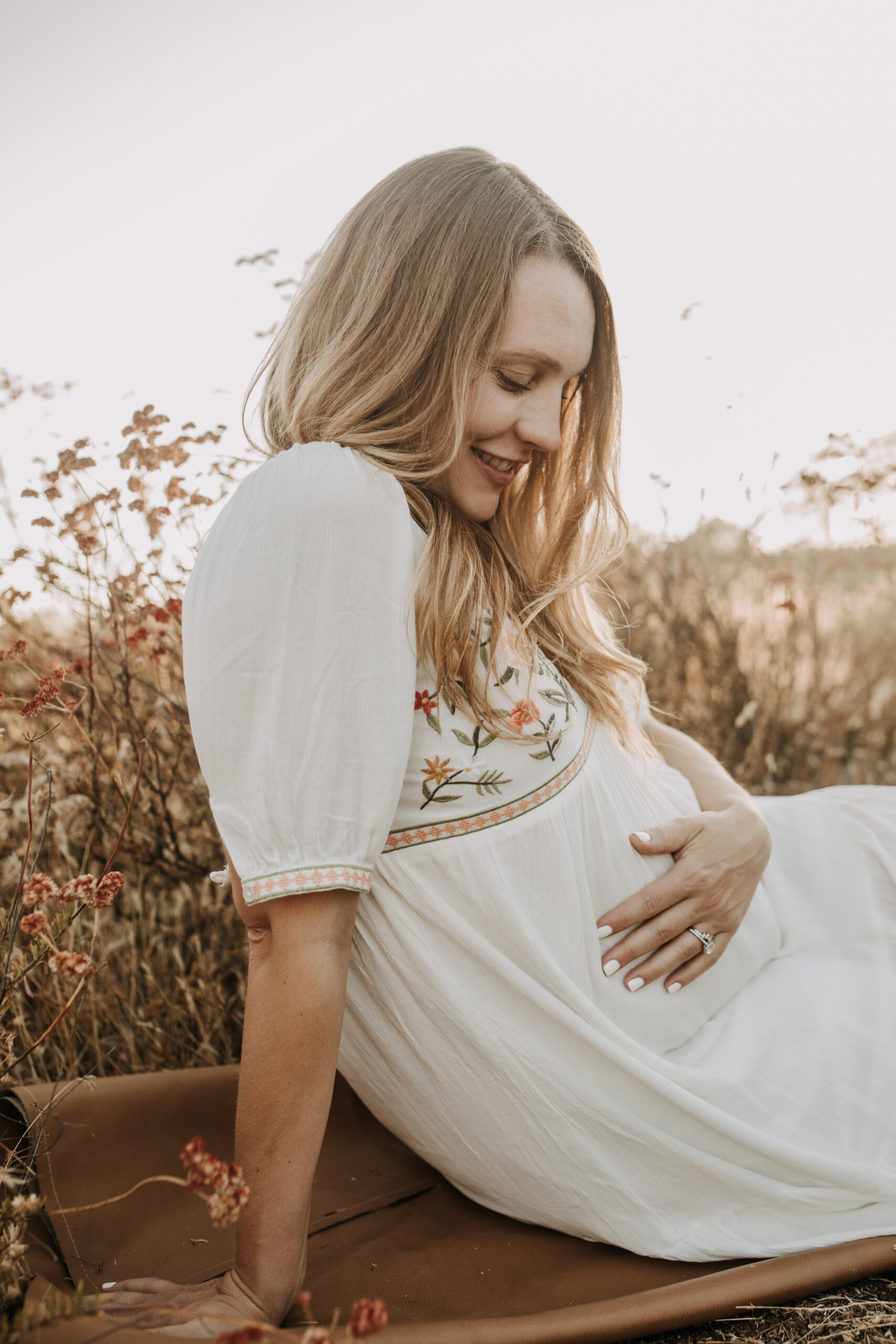 outdoor maternity photos warm and sunny maternity photos couples photos summer field white dress pregnancy San Diego photographer Sabrina kinsella