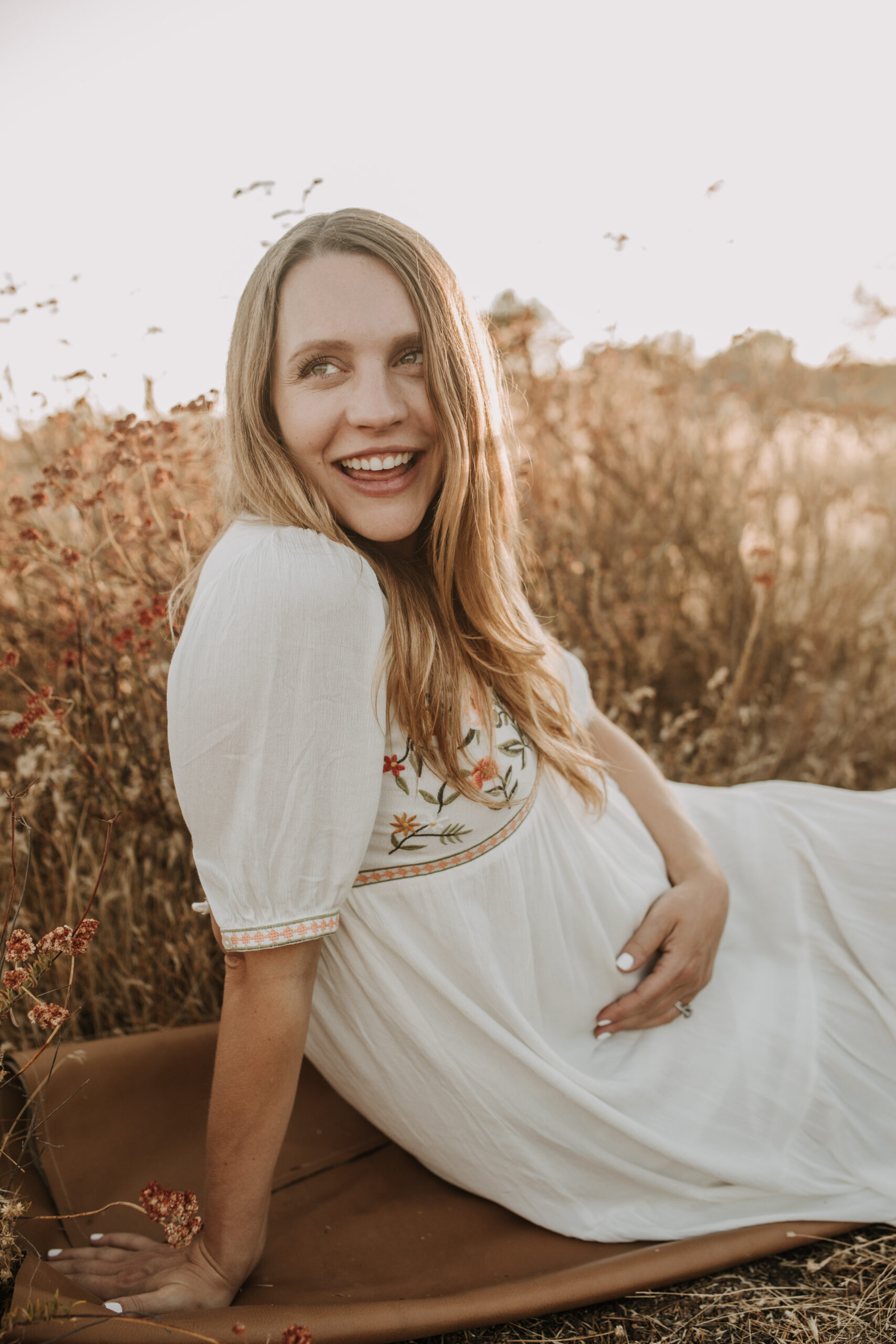 outdoor maternity photos warm and sunny maternity photos couples photos summer field white dress pregnancy San Diego photographer Sabrina kinsella