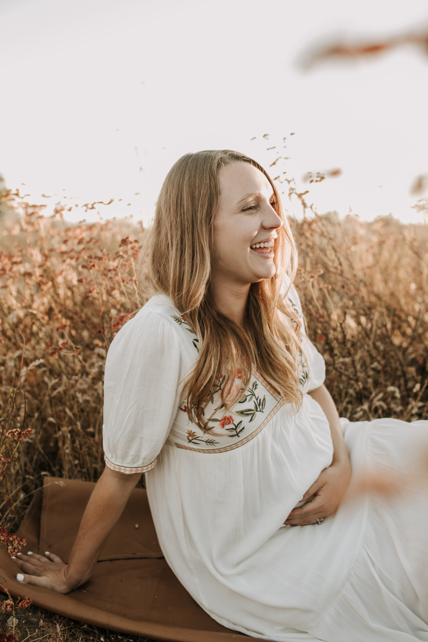 outdoor maternity photos warm and sunny maternity photos couples photos summer field white dress pregnancy San Diego photographer Sabrina kinsella