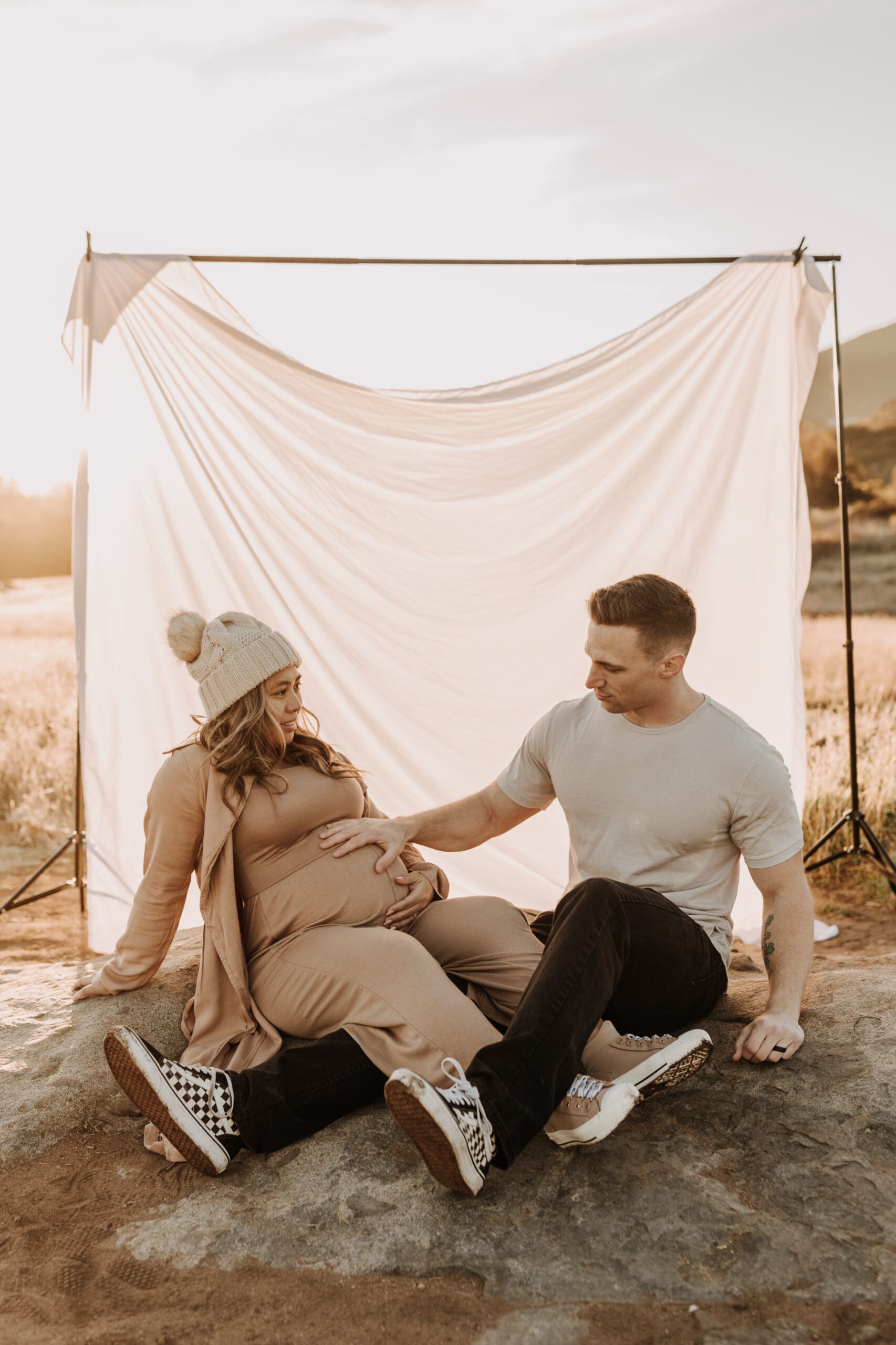 warm outdoor sunrise maternity photos San Diego brown tones backdrop pregnancy San Diego family photographer Sabrina kinsella