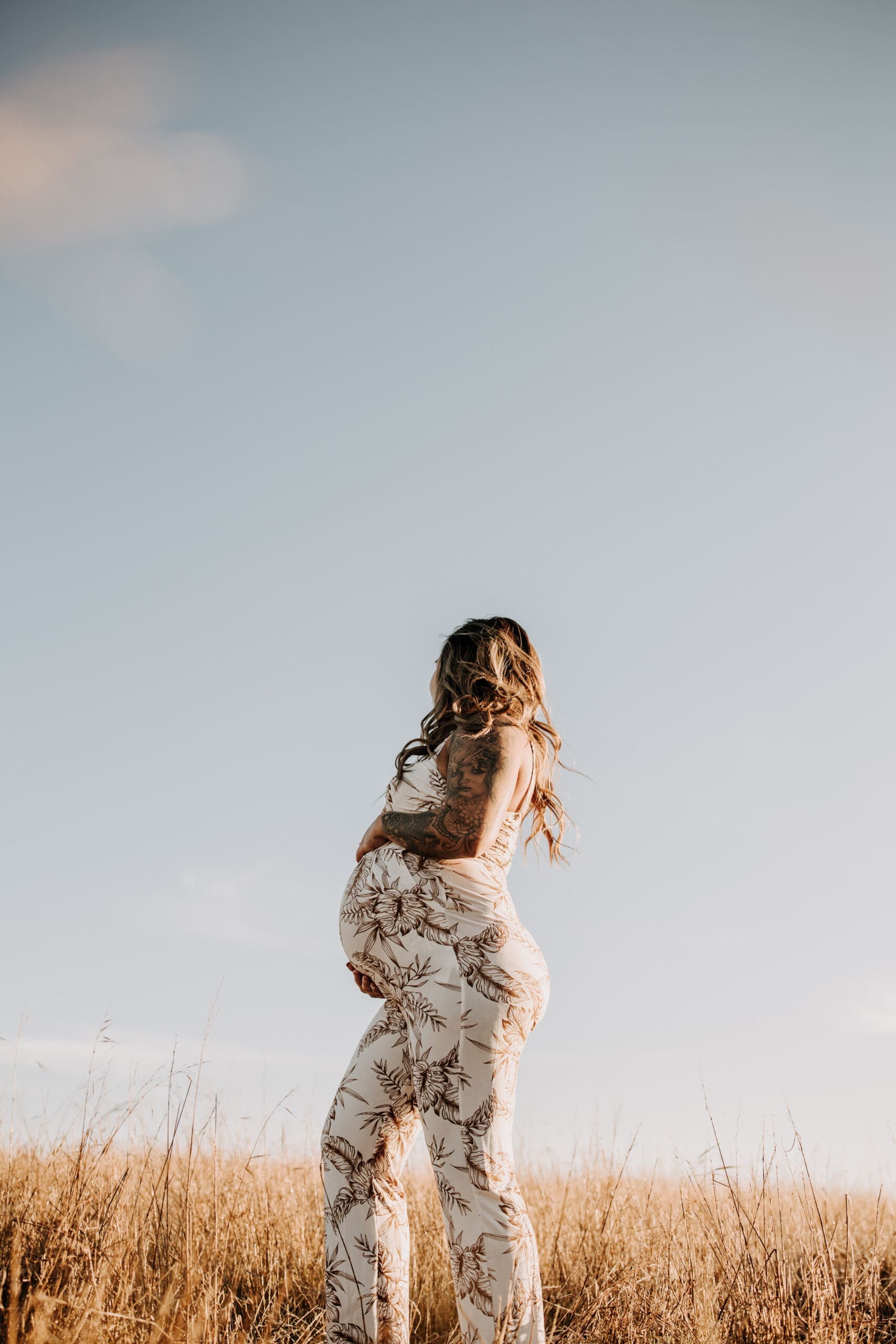 warm outdoor sunrise maternity photos San Diego brown tones backdrop pregnancy San Diego family photographer Sabrina kinsella