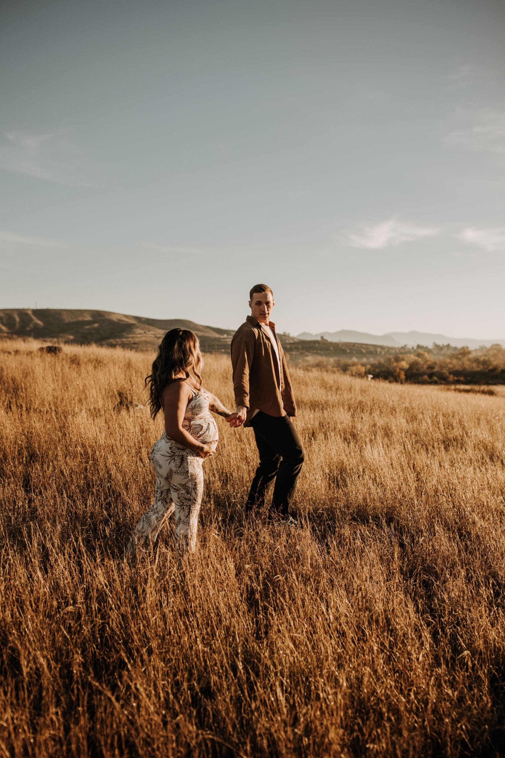 warm outdoor sunrise maternity photos San Diego brown tones backdrop pregnancy San Diego family photographer Sabrina kinsella