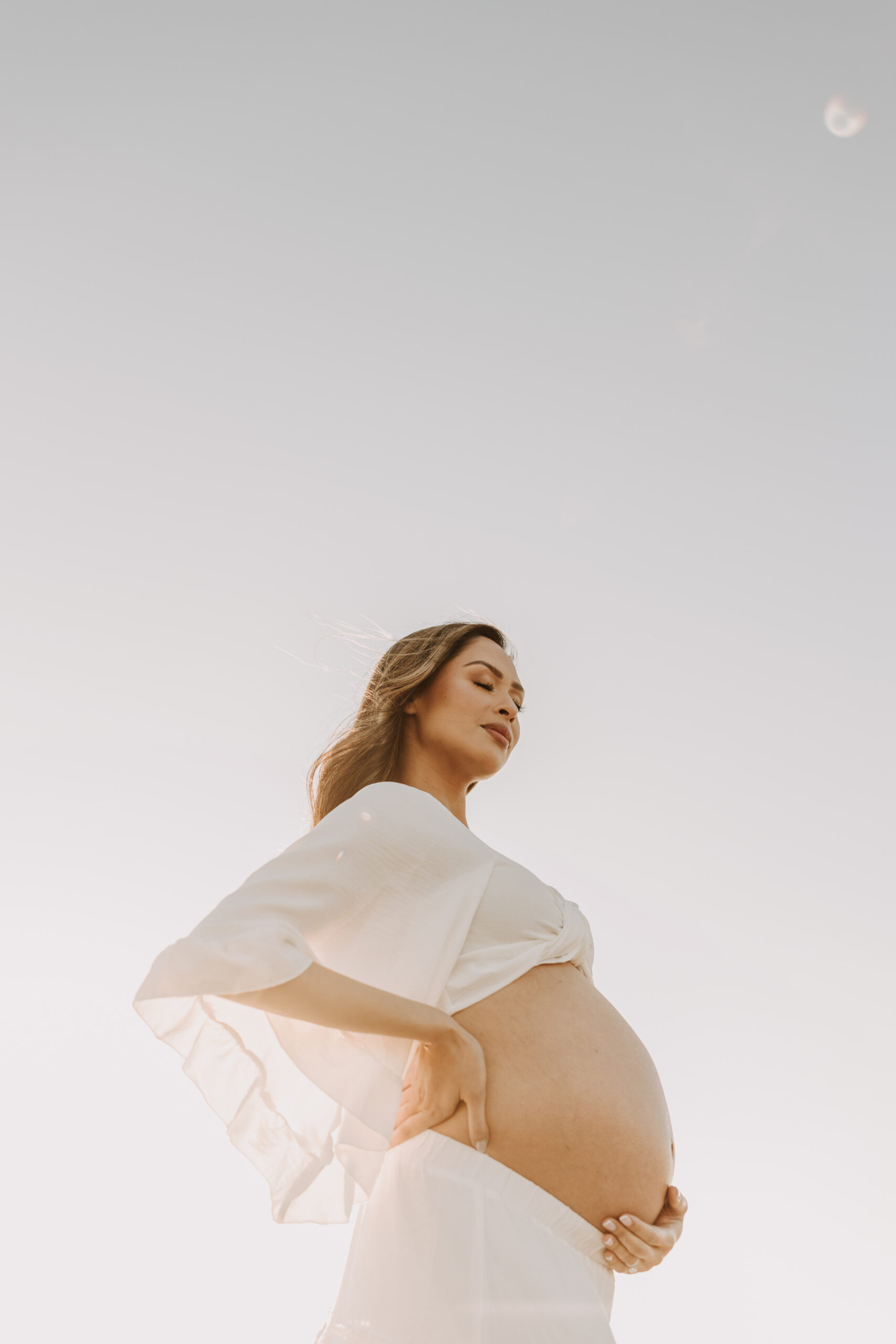 maternity fashion maternity photos beach photos sunset golden hour San Diego maternity photos blue dress pregnancy bright beautiful San Diego family photographer Sabrina kinsealla sabrinalynnphoto