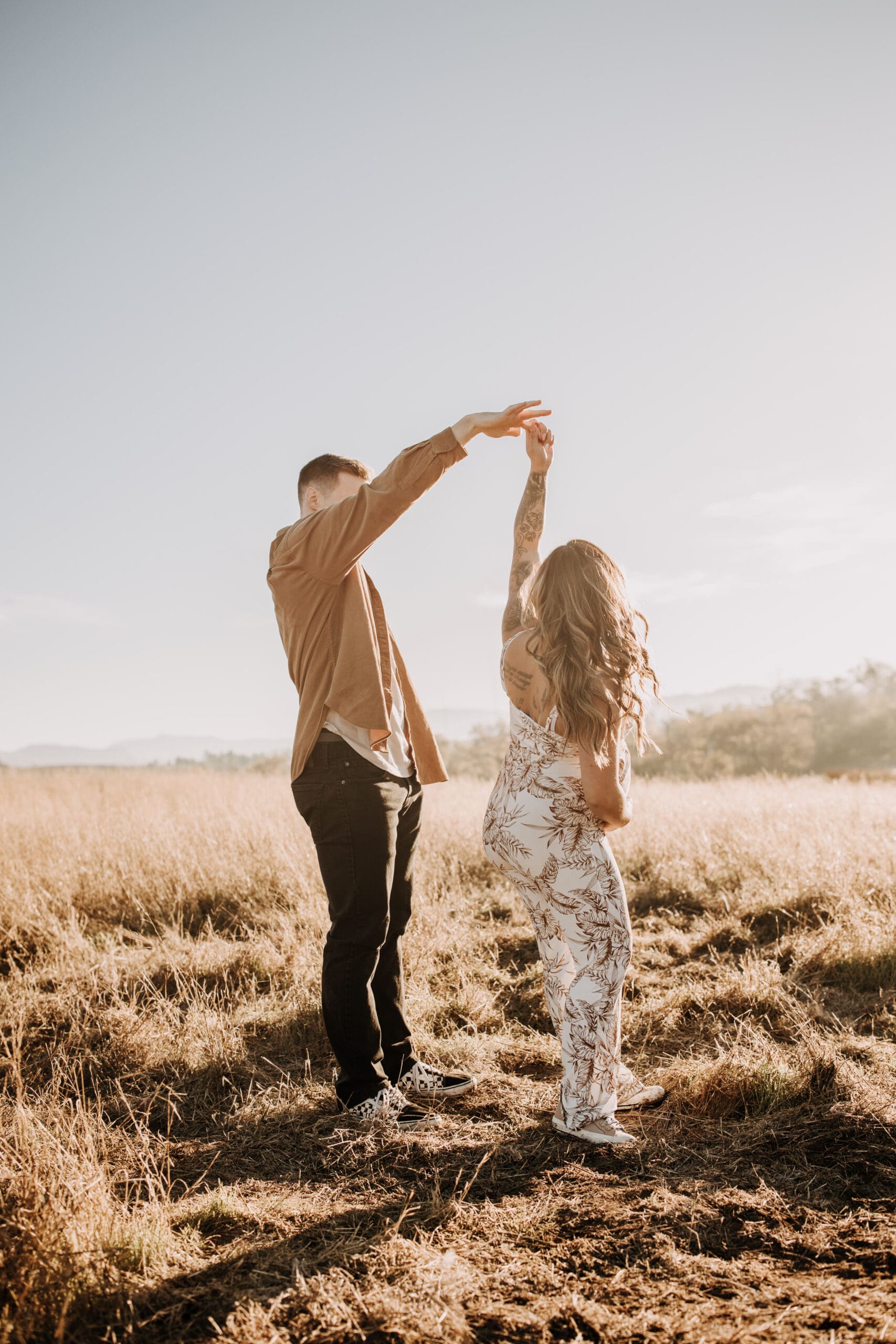 warm outdoor sunrise maternity photos San Diego brown tones backdrop pregnancy San Diego family photographer Sabrina kinsella