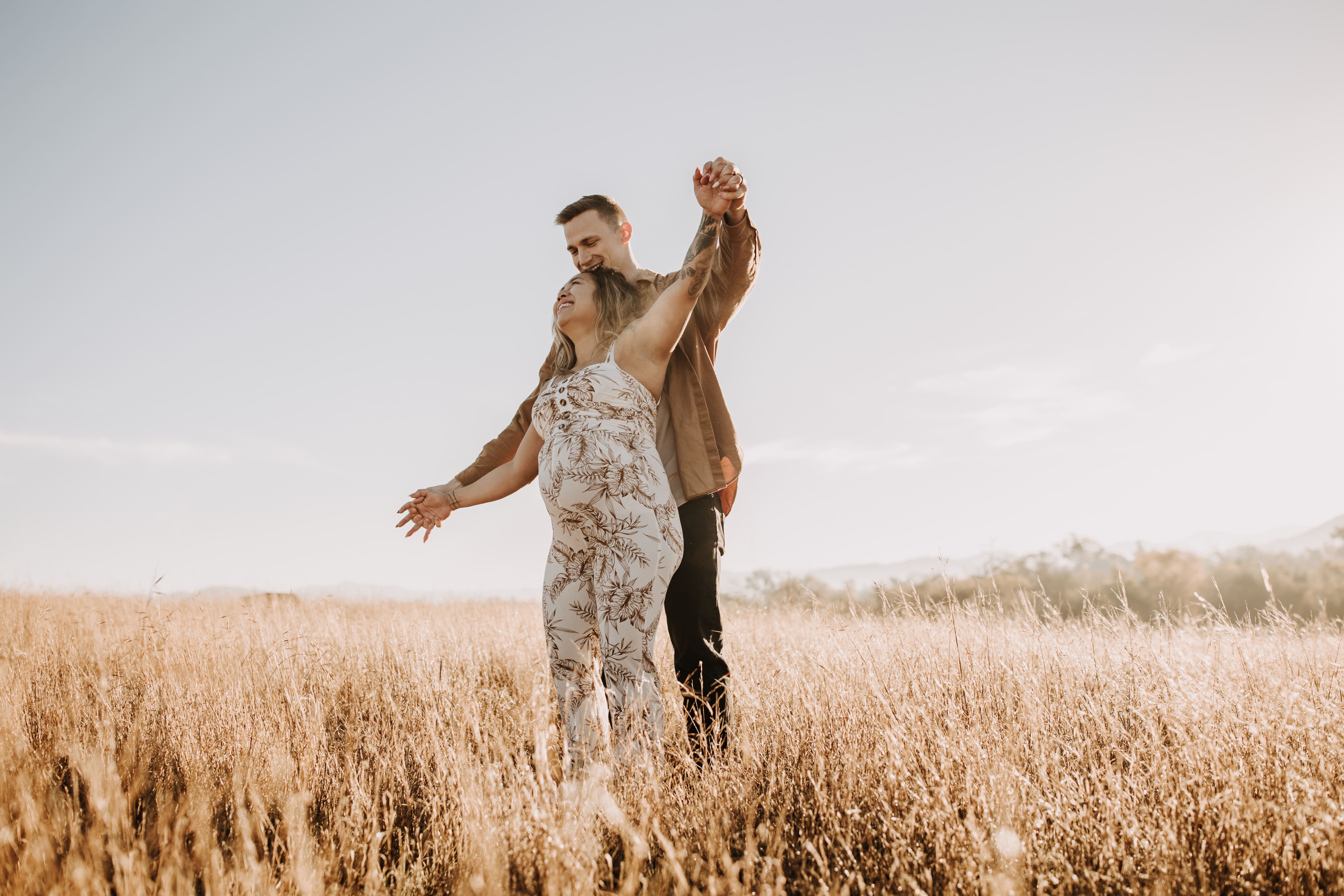 warm outdoor sunrise maternity photos San Diego brown tones backdrop pregnancy San Diego family photographer Sabrina kinsella