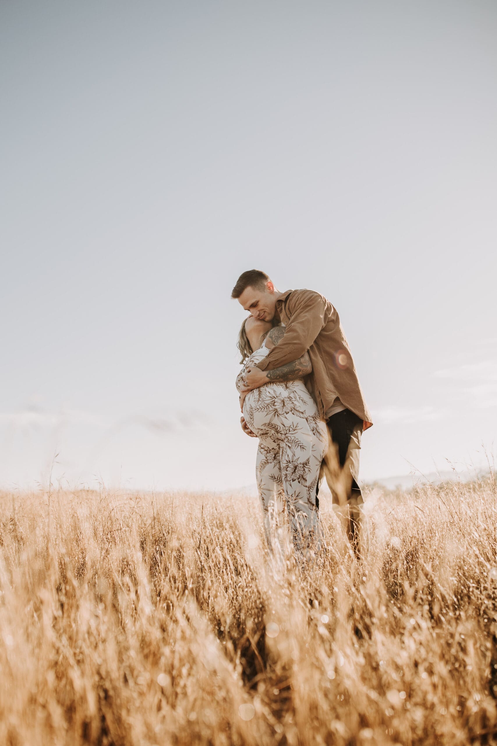 warm outdoor sunrise maternity photos San Diego brown tones backdrop pregnancy San Diego family photographer Sabrina kinsella