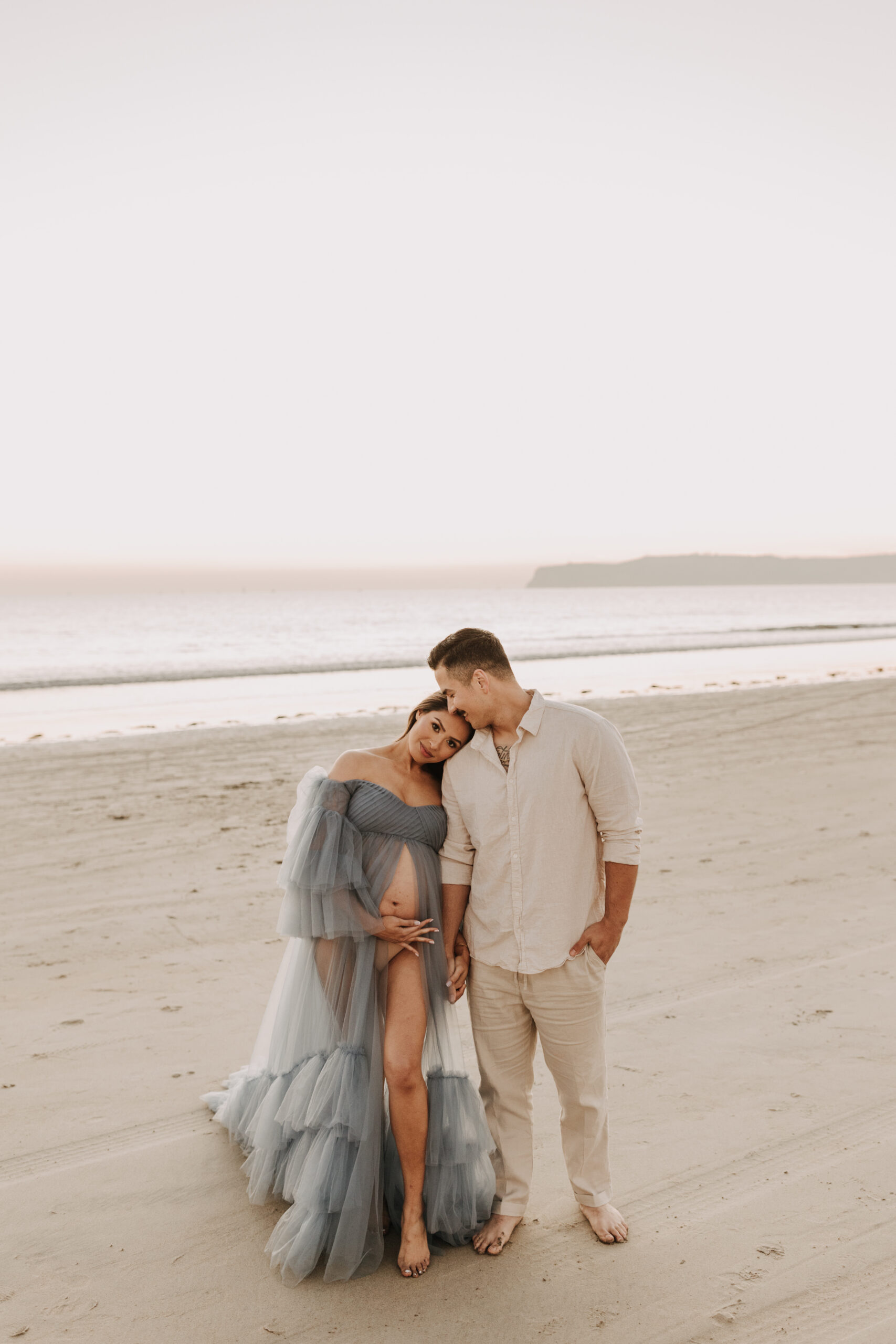 maternity fashion maternity photos beach photos sunset golden hour San Diego maternity photos blue dress pregnancy bright beautiful San Diego family photographer Sabrina kinsealla sabrinalynnphoto