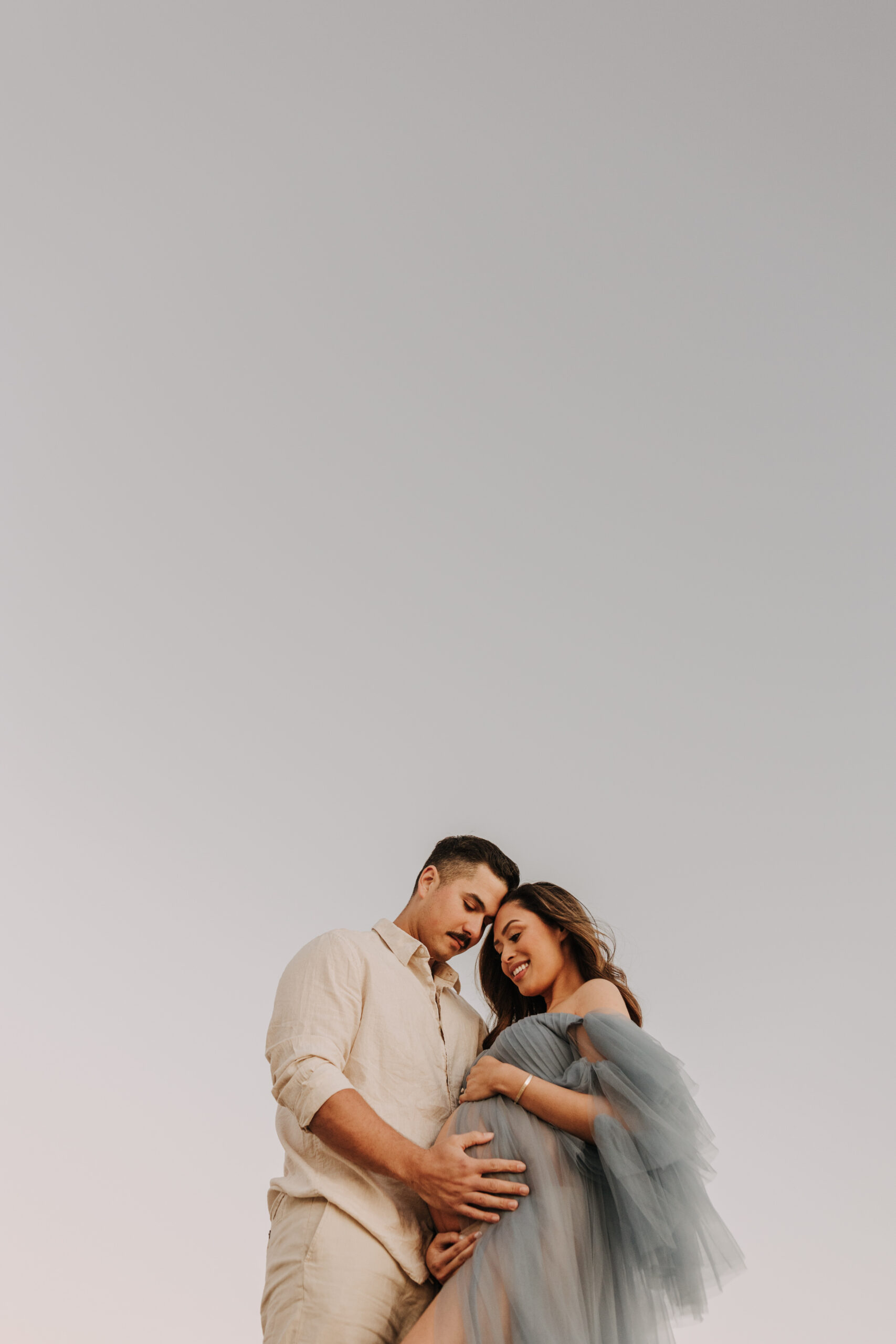 maternity fashion maternity photos beach photos sunset golden hour San Diego maternity photos blue dress pregnancy bright beautiful San Diego family photographer Sabrina kinsealla sabrinalynnphoto