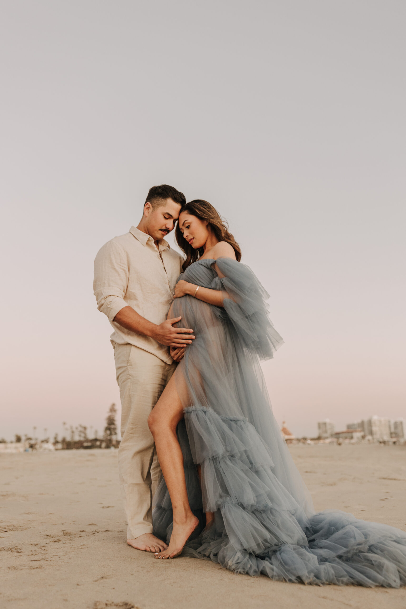 maternity fashion maternity photos beach photos sunset golden hour San Diego maternity photos blue dress pregnancy bright beautiful San Diego family photographer Sabrina kinsealla sabrinalynnphoto